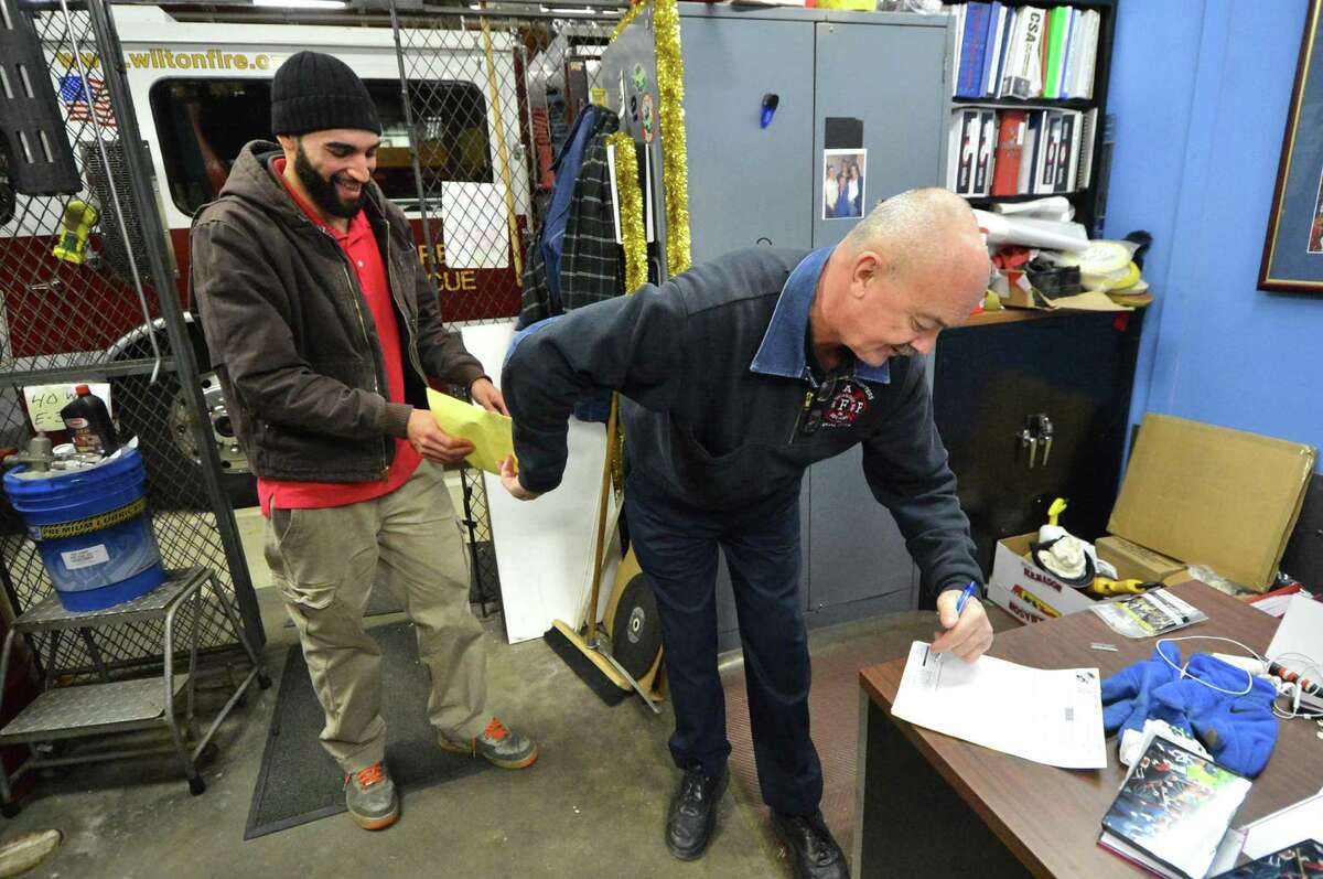 Wilton Fire Department Apparatus Supervisor Ralph Nathanson will retire after 36 years of service with the town, on Tuesday December 20, 2016, Ralph signs for supplies during work at headquarters. Ralph has been responsible for the repair and maintenance of the department's vehicles including the fire trucks, ATV's, trailers and all the support vehicles for the department in Wilton Conn.
