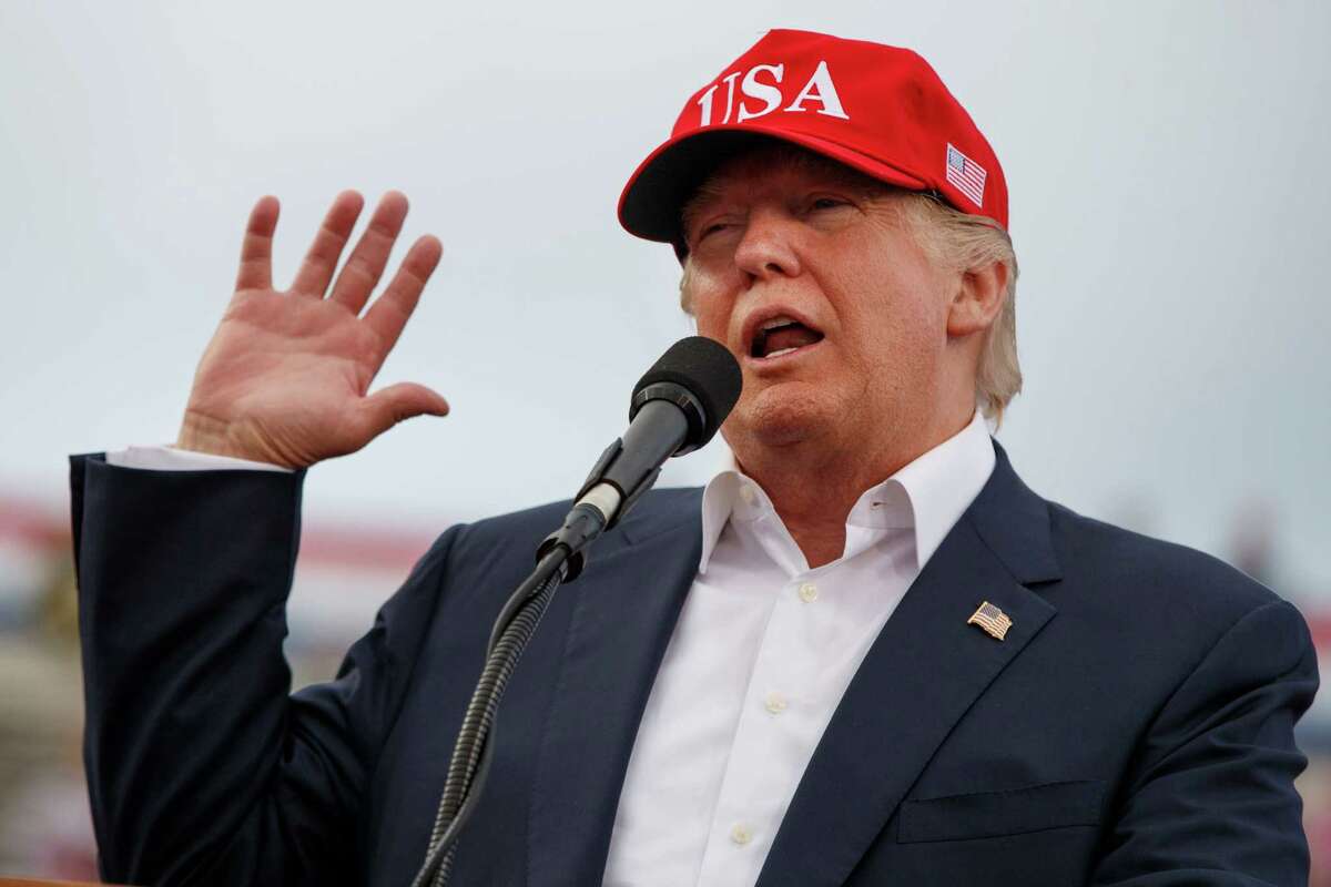 FILE - In this Saturday, Dec. 17, 2016, file photo, President-elect Donald Trump speaks during a rally at Ladd-Peebles Stadium in Mobile, Ala. Trump is poised to meet with his incoming national security adviser on Wednesday, Dec. 20, in the aftermath of a rattling day of violence around the world. (AP Photo/Evan Vucci, File)