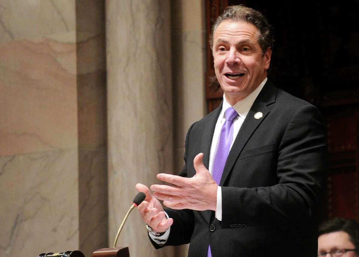 New York Gov. Andrew Cuomo speaks to members of New York state's Electoral College before voting for president in the Senate Chamber of the Capitol in Albany, N.Y., Monday, Dec. 19, 2016. (AP Photo/Hans Pennink via AP, Pool) ORG XMIT: NYHP12