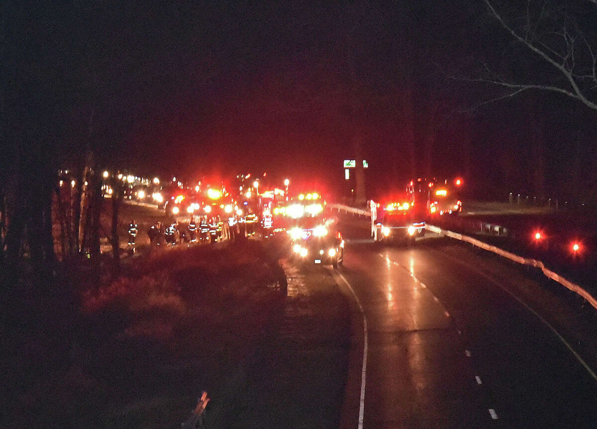 The Norwalk Fire Department along with the Westport Fire Department at the scene of an accident where a car ended up about 40 feet off the Merritt Parkway near exit 41 in Westport on Wednesday, Dec. 21, 2016.