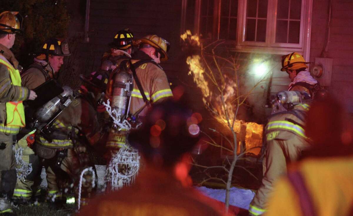 Stamford fire displaces family, injures two