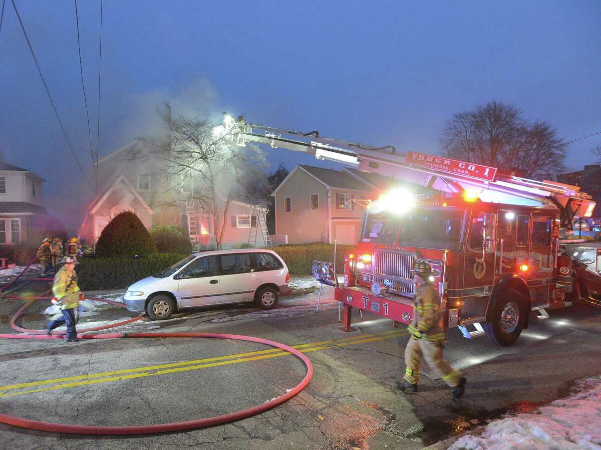 Stamford fire displaces family, injures two