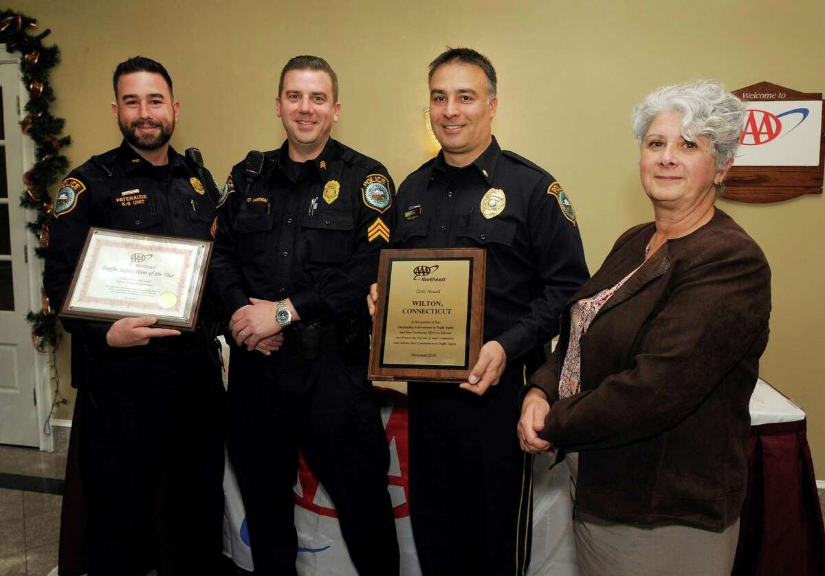 At AAA?’s 7th Annual Community Traffic Safety Awards lunch recently at Testo?’s in Bridgeport, Public Affairs Manager Fran Mayko, right, presented the awards to, from left, Officer Patenaude; Sgt. David Hartman, who is a AAA Driving Improvement Instructor; and Lieut. Robert Kluk.