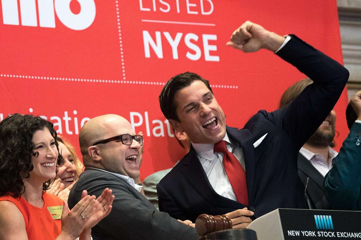 Twilio founder and CEO Jeff Lawson, center, reacts after ringing the opening bell to celebrate Twilio's initial public offering, at the New York Stock Exchange, June 23, 2016, in New York City.