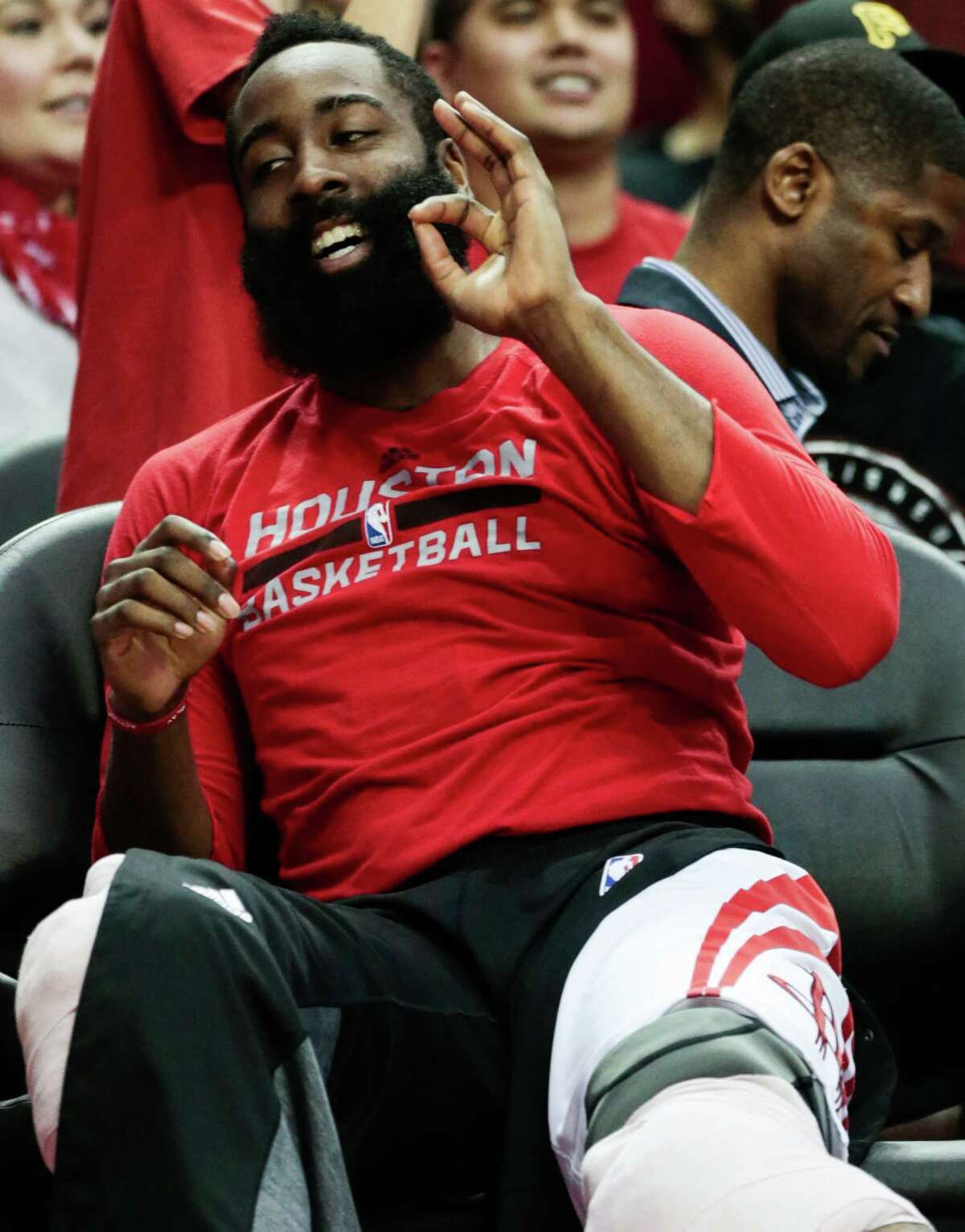Houston Rockets guard James Harden (13) reacts after Rockets forward Kyle Wiltjer (30) scored a 3-pointer against the Sacramento Kings during the second half of an NBA basketball game at Toyota Center on Wednesday, Dec. 14, 2016, in Houston. ( Brett Coomer / Houston Chronicle )