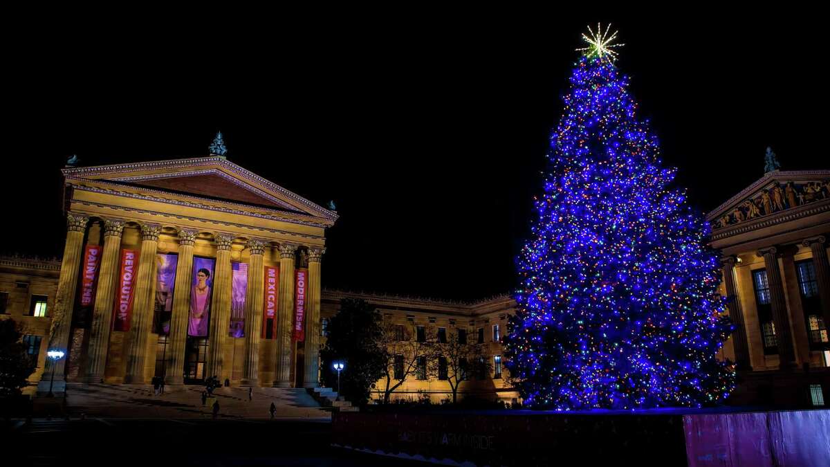 Adorned with glittering holiday lights, a gigantic holiday tree dominates the top of the Philadelphia Museum of Art’s world-famous steps, bringing a festive accent to the city vista.