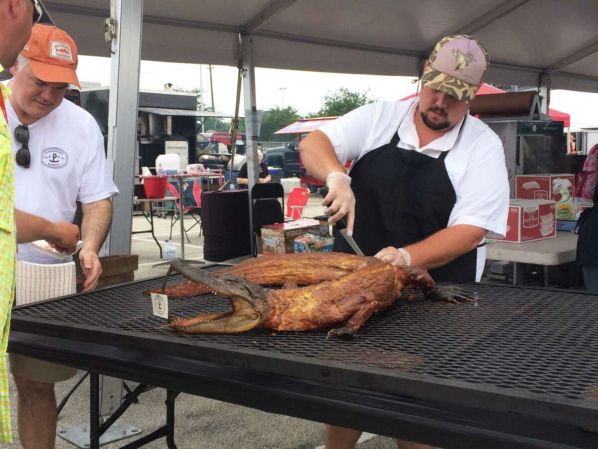 Grant Pinkerton of Pinkerton's BBQ served smoked alligator at the Houston Barbecue Festival.