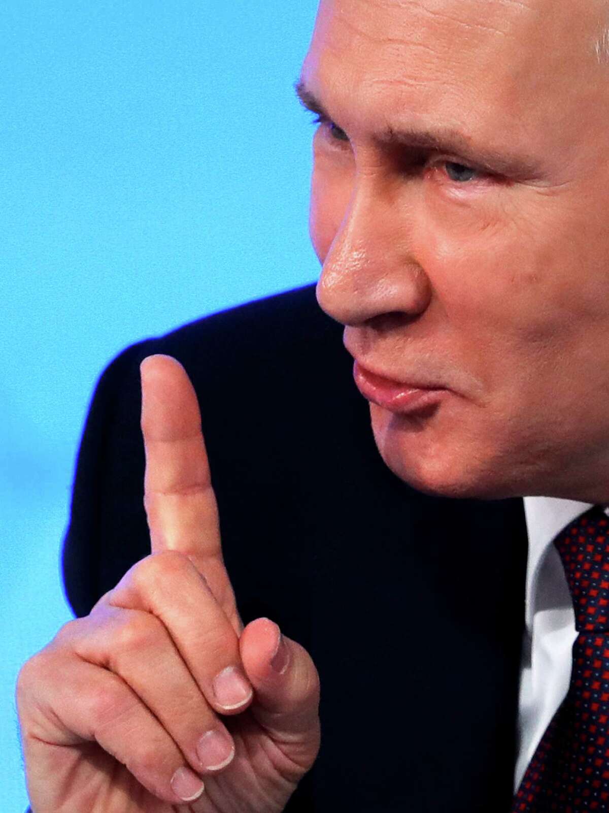 Russian President Vladimir Putin gestures while speaking during his annual news conference in Moscow, Russia, Friday, Dec. 23, 2016. (AP Photo/Pavel Golovkin)