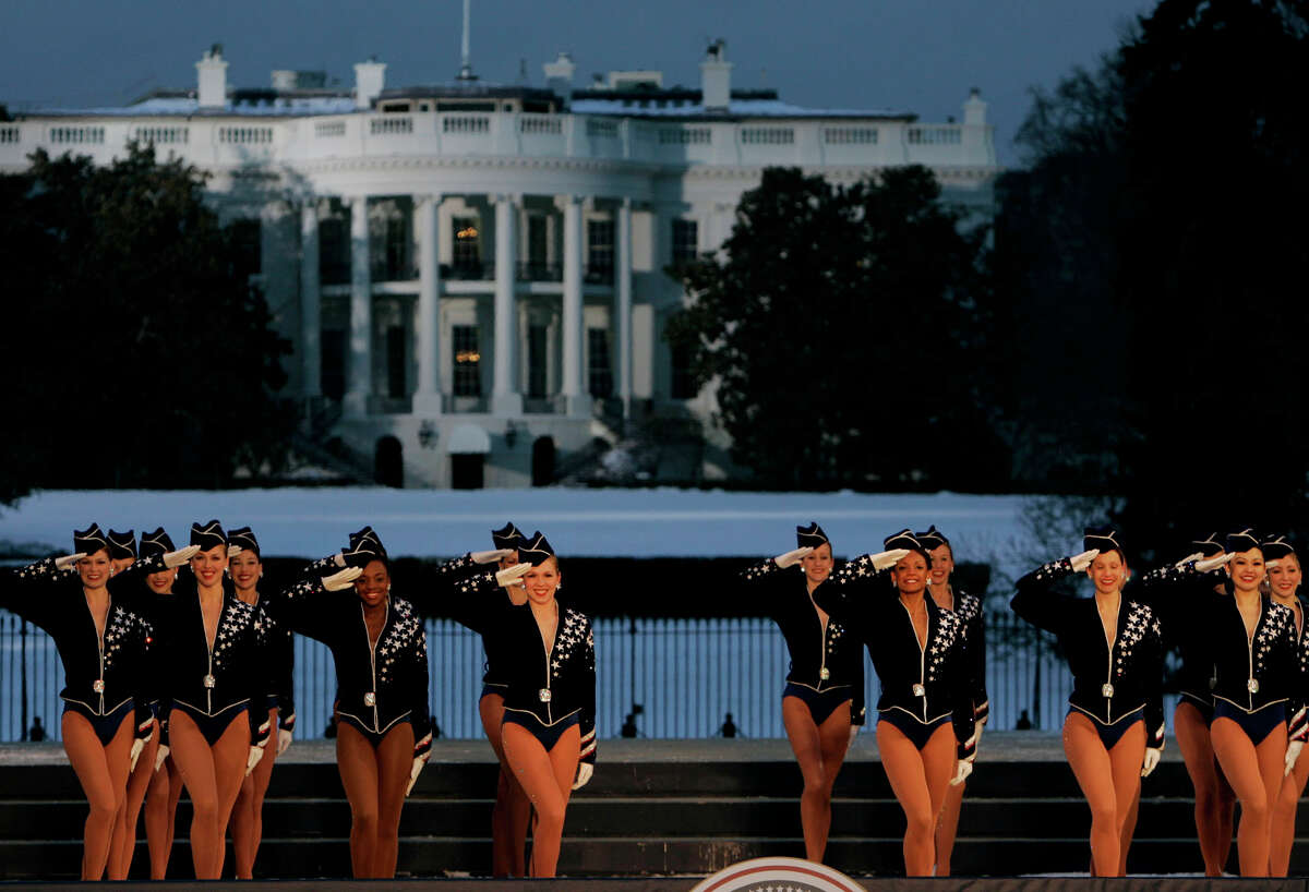 FILE - In this Wednesday, Jan. 19, 2005, file photo, the Rockettes perform during the Celebration of Freedom Concert on the Ellipse, with the White House in the background in Washington. The Radio City Rockettes have been assigned to dance at President-elect Donald TrumpÂ?’s inauguration January 2017. (AP Photo/Chris Gardner, File)