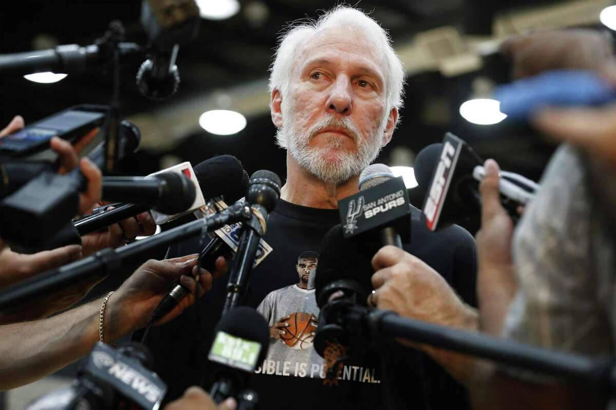 Spurs coach Gregg Popovich keeps his emotions in check as he addresses the media a day after Tim Duncan announced his retirement from the game on Tuesday, July 12, 2016. Popovich wore a t-shirt with the likeness of Duncan as he reflected on his relationship with the 19-year Spurs veteran and talked about his contributions to the team and to him personally. (Kin Man Hui/San Antonio Express-News)