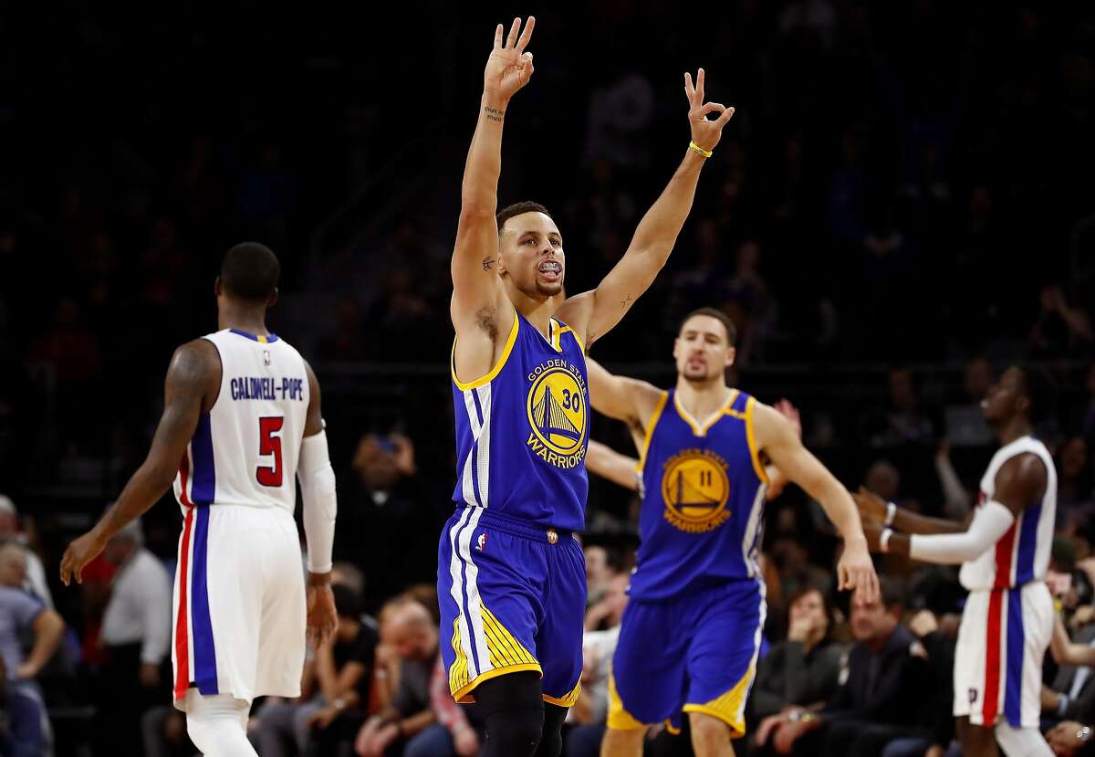 Stephen Curry #30 of the Golden State Warriors reacts to a fourth quarter three point basket by teammate Klay Thompson #11 while playing the Detroit Pistons at the Palace of Auburn Hills on December 23, 2016 in Auburn Hills, Michigan.