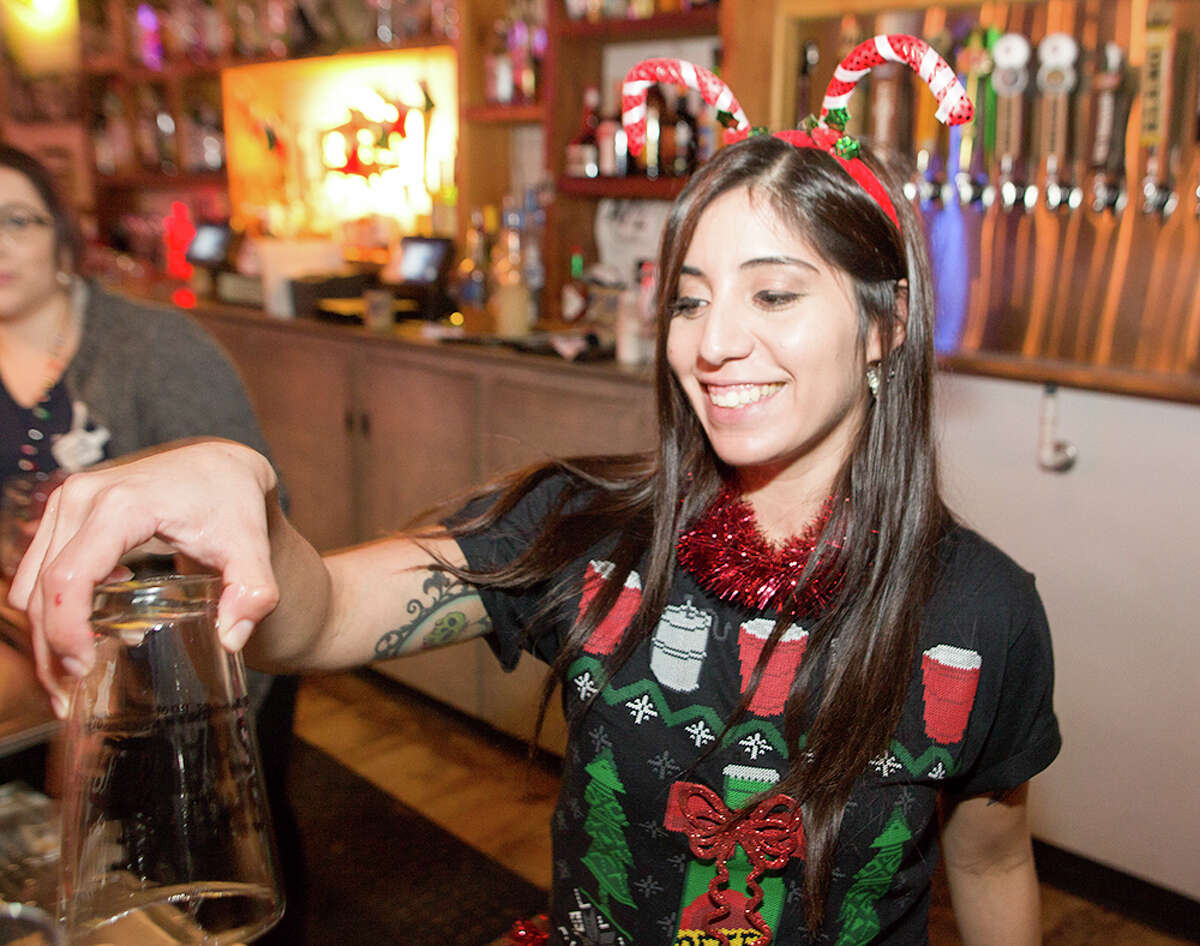 Neighborhood bar The Pigpen celebrated Christmas and its one year anniversary with a huge bash Friday night, Dec. 23, 2016.