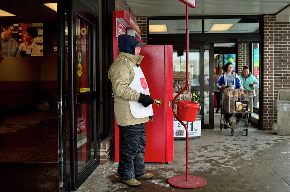 The Salvation Army's red kettle bells ring outside Kroger this holiday  season