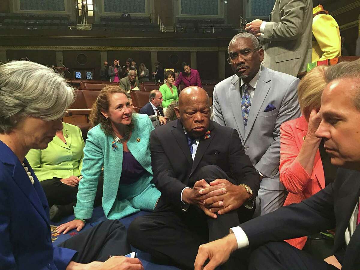 ﻿Rep. Elizabeth Esty, second from left, Rep. John Lewis, center, and other members of Congress stage a sit-in on the floor of the U.S. House of Representatives on June 22, 2016, demanding a vote on gun control.﻿