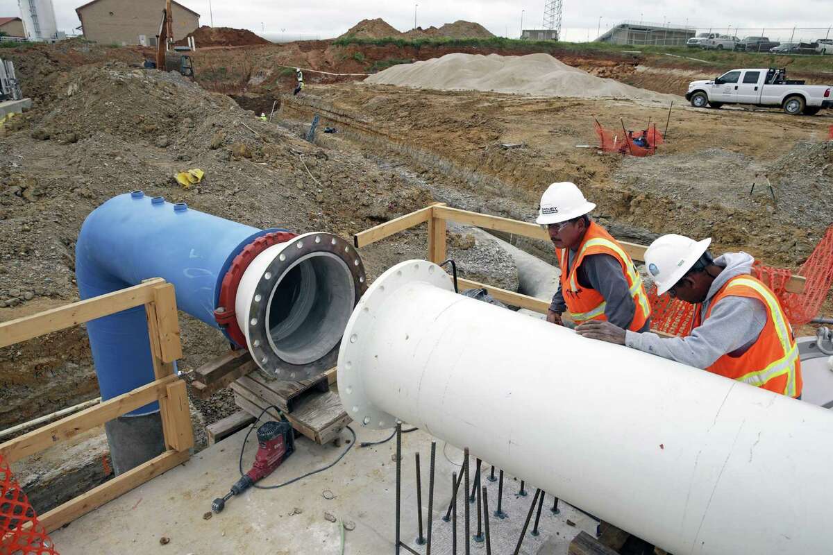 A large pipe leads to a terminal point where treated water will be exported from the plant as construction continues on the SAWS brackish groundwater desalination plant in south Bexar County on April 13, 2016.