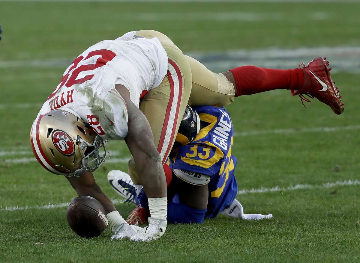 Los Angeles Rams cornerback E.J. Gaines hits San Francisco 49ers running back Carlos Hyde forcing a fumble during the second half of an NFL football game Saturday, Dec. 24, 2016, in Los Angeles. (AP Photo/Rick Scuteri)