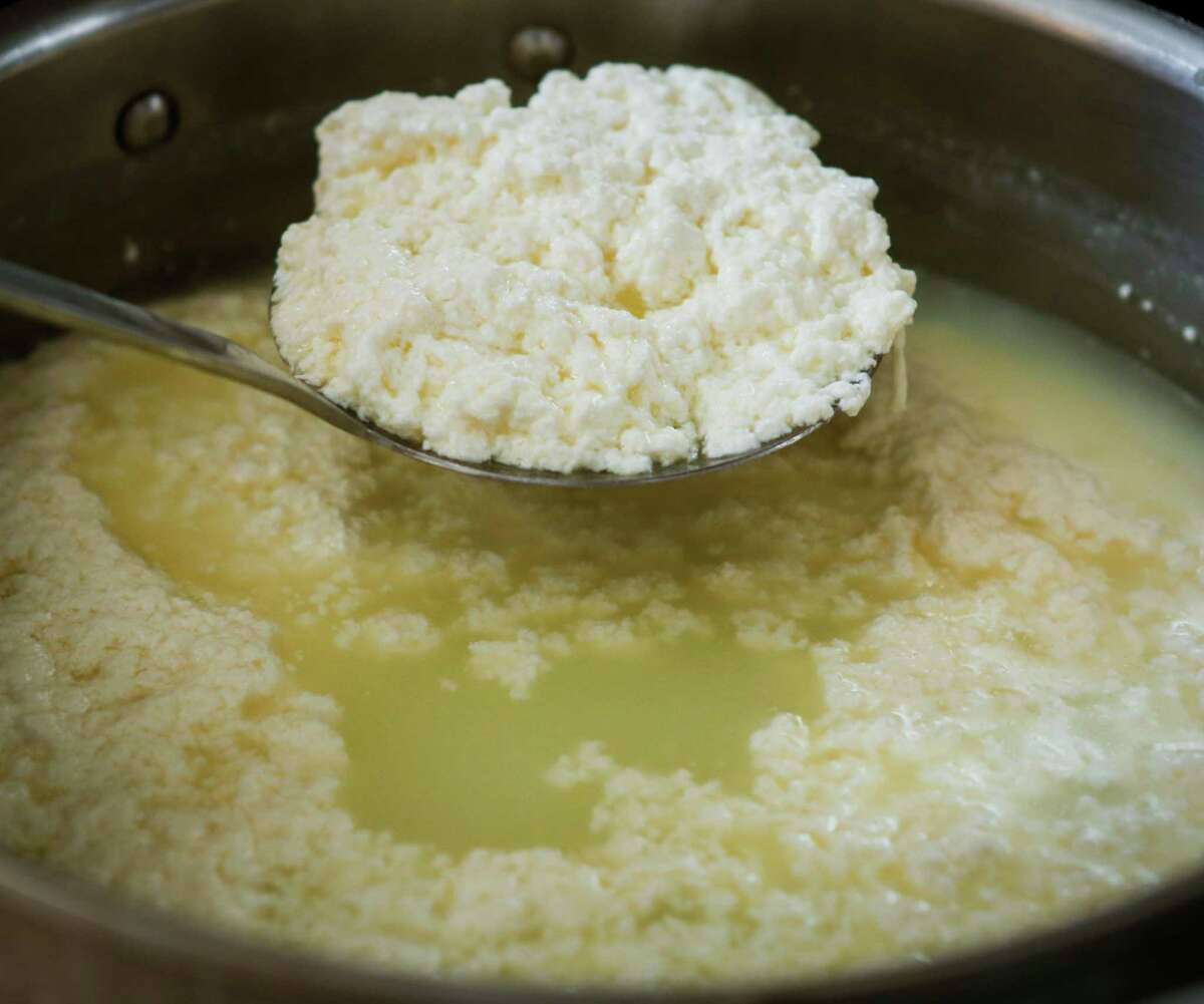 The use of whey -- a byproduct of cheese making and yogurt production -- is a food trend for 2017. Shown: Curds are separated from whey to make ricotta cheese.