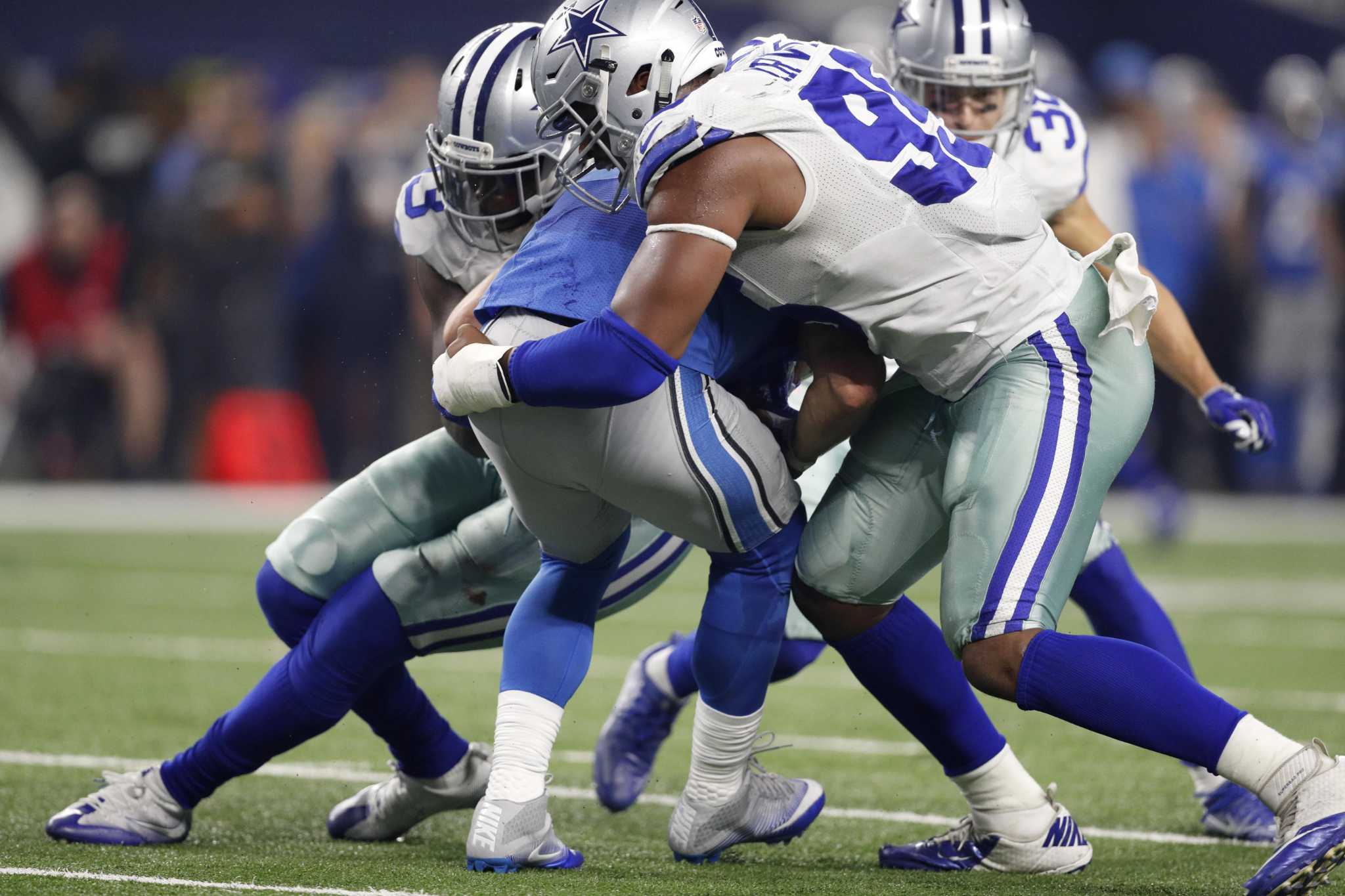 Bryant, Cowboys keep Lions' playoff hopes on hold, 42-21