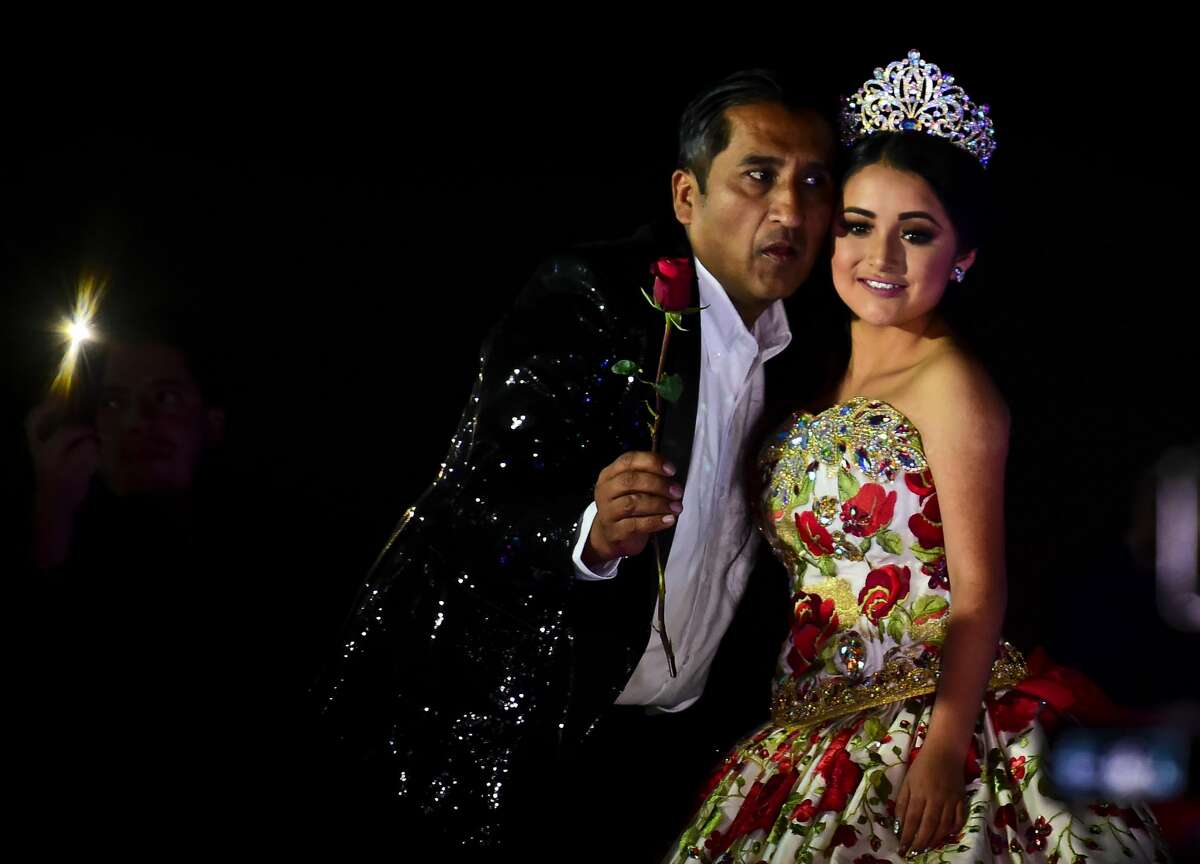 Rubi Ibarra poses during her 15th birthday celebrations in Villa Guadalupe, San Luis Potosi State, on December 26, 2016. Rubi, a small-town Mexican teen, welcomed thousands of guests for her 15th birthday party after her parents' video invitation to the milestone event went viral online. 
