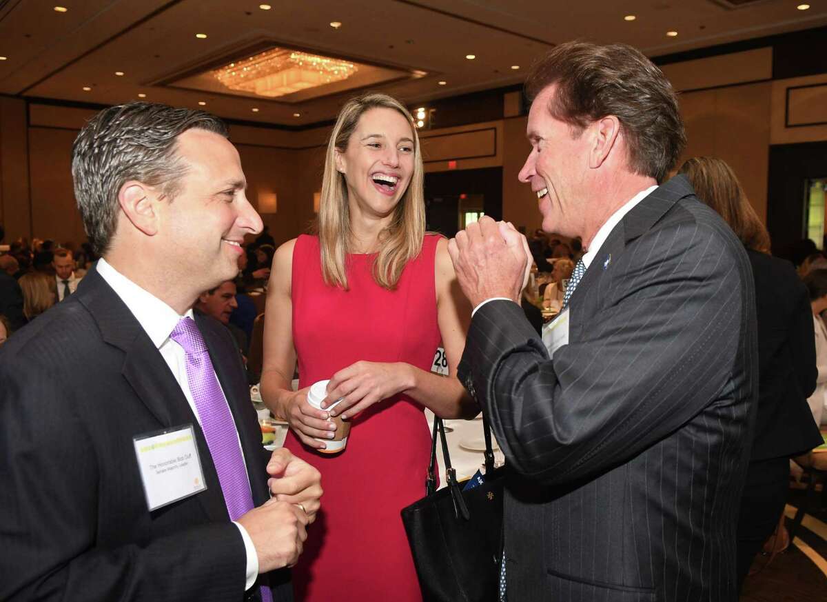 State Rep. Caroline Simmons shares a light moment with State Senator Bob Duff, left, and State Senator L. Scott Frantz at the Women's Business Development Council's annual breakfast at the Hyatt in Greenwich, Sept. 23, 2016.
