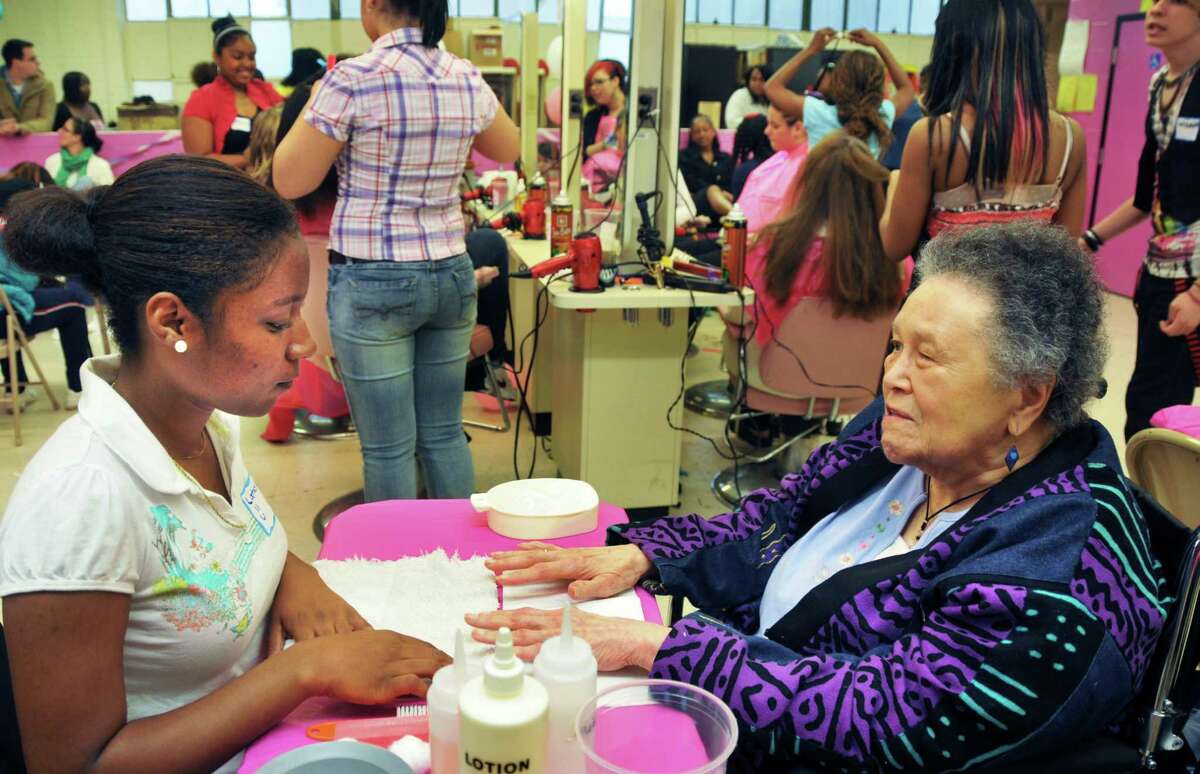Margaret Cunningham, 91, of Schenectady, gets a manicure from Albany High cosmetology student Latasia George, 17, (at left) as students and faculty at Abrookin Vocational-Technical Center in Albany host a Mother's Day event Saturday May 8, 2010. (John Carl D'Annibale / Times Union)