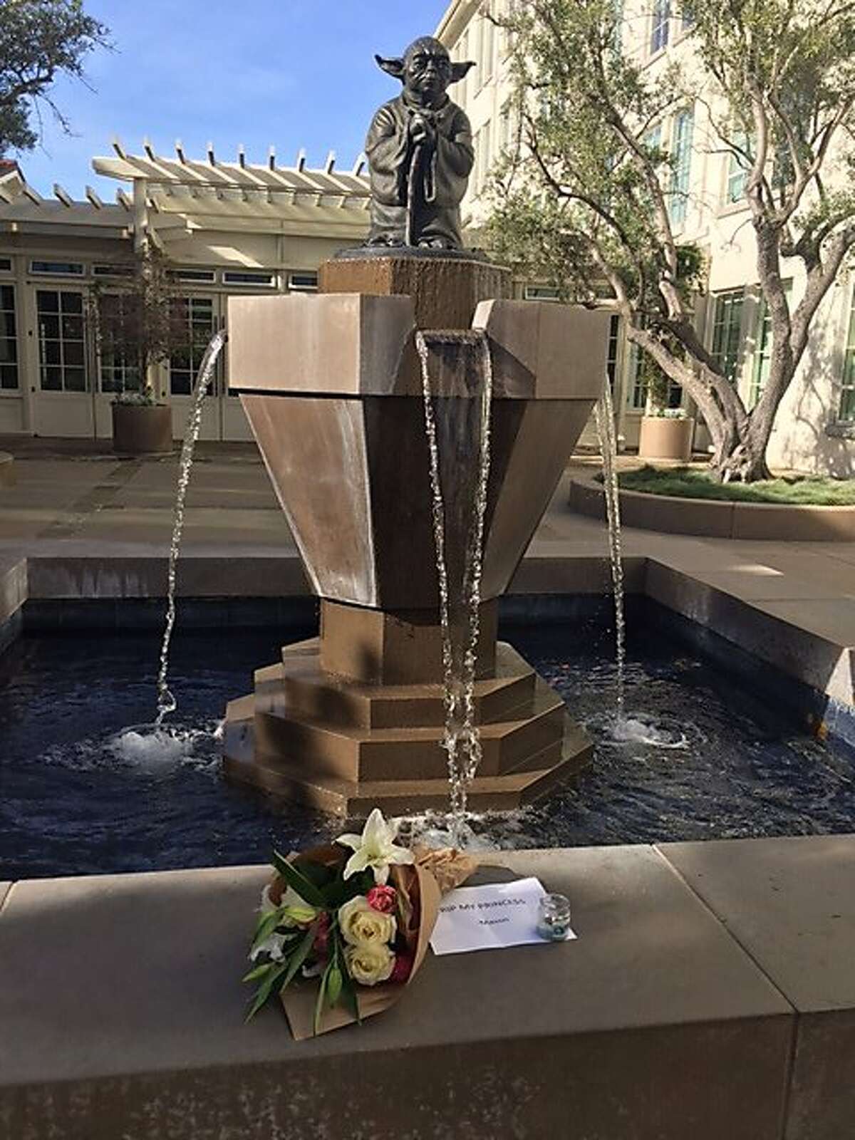 A tribute to Carrie Fisher sits at the Yoda fountain in front of Lucasfilm offices in San Francisco on Thursday, December 27, 2017.
