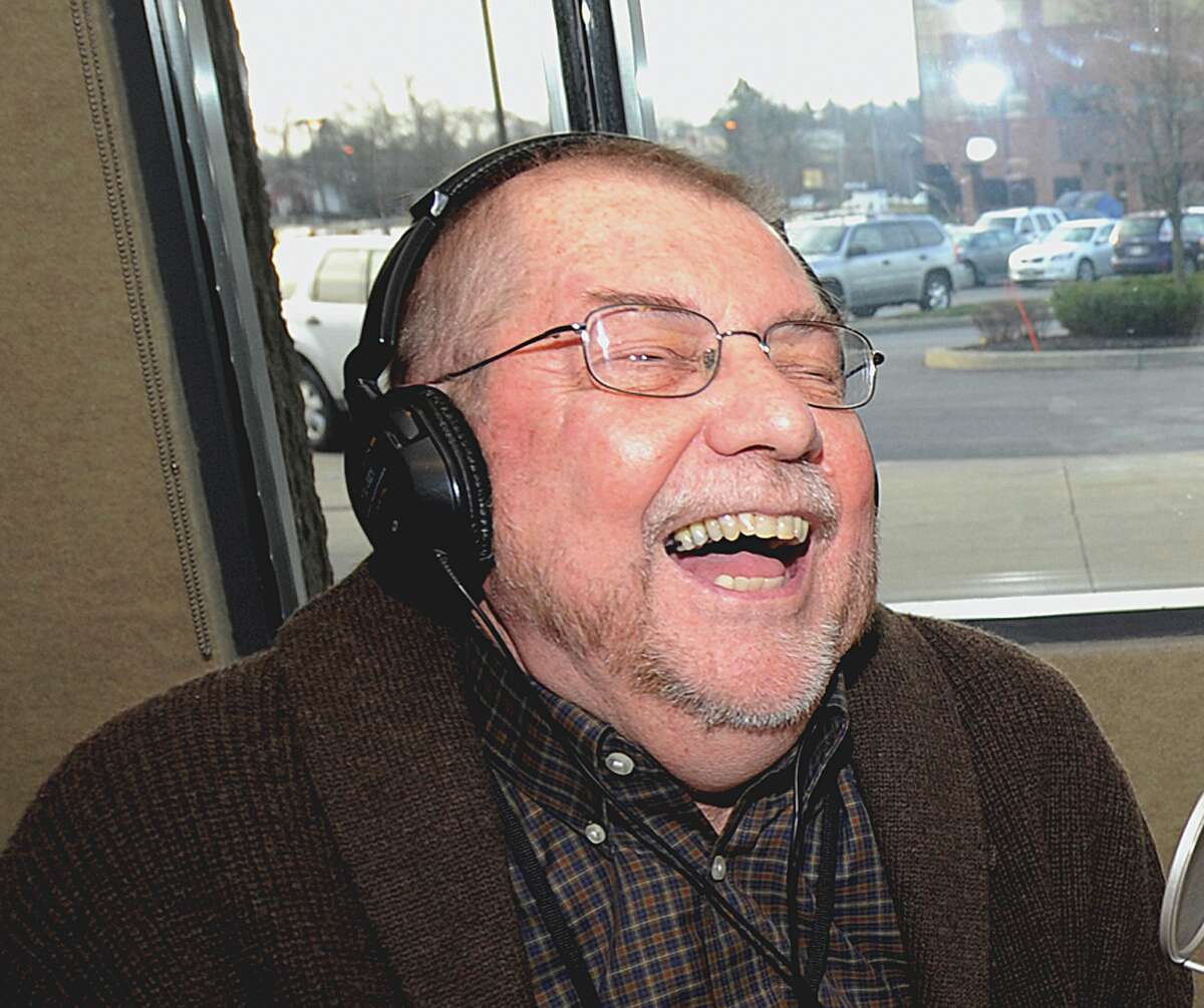 Radio personality Don Weeks enjoys a last laught as he winds up his last moments after a thirty year career at WGY in Latham December 3, 2010. (Skip Dickstein / Times Union)