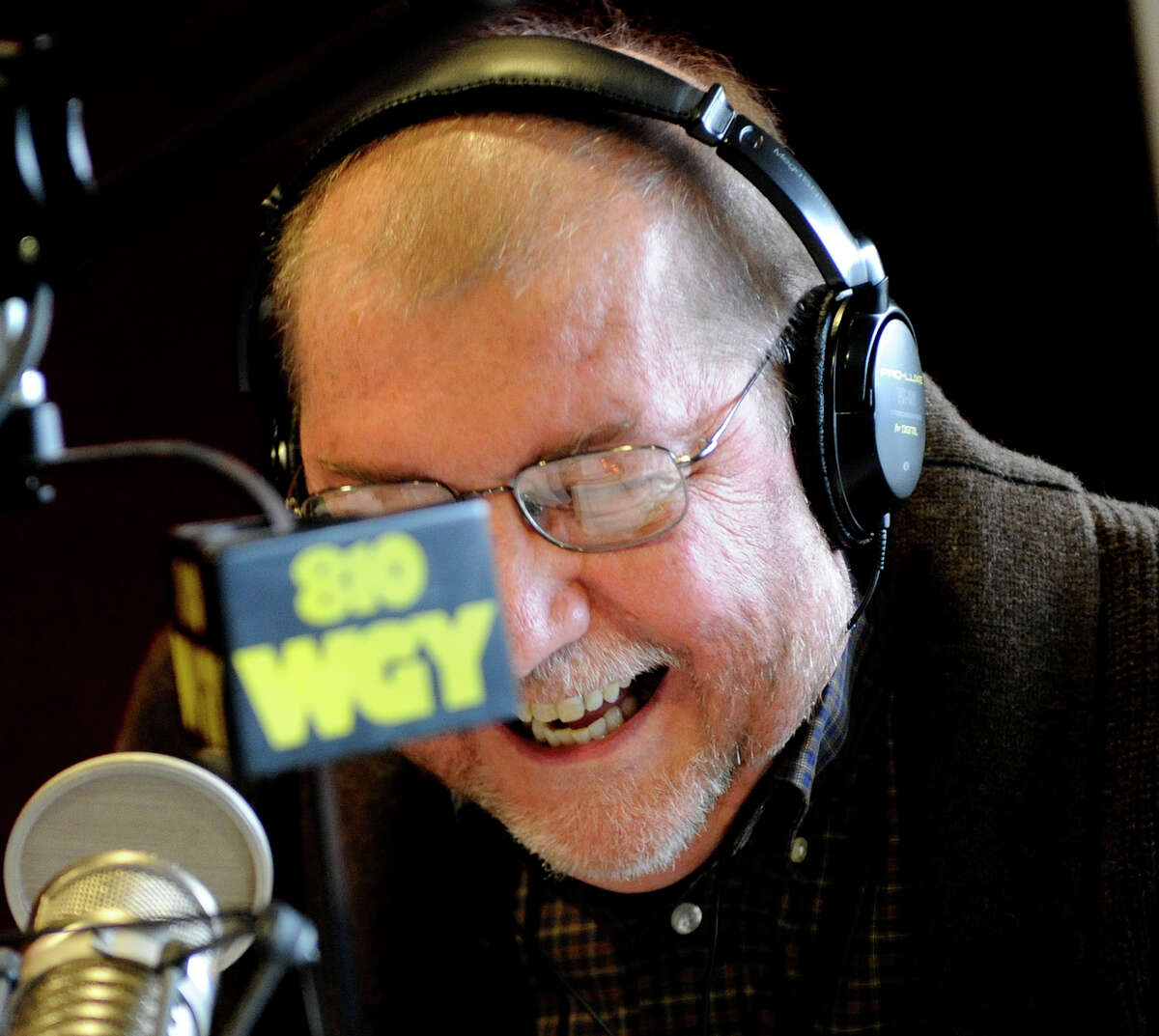 Radio personality Don Weeks enjoys a last laugh as he winds up his last moments after a thirty year career at WGY in Latham December 3, 2010. (Skip Dickstein / Times Union)