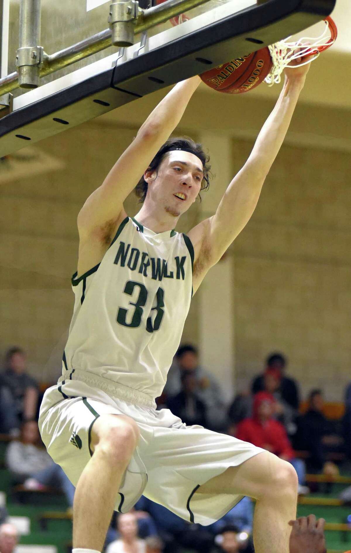 Norwalk’s Peter Kotulsky dunks the ball during the second half of Tuesday’s game.