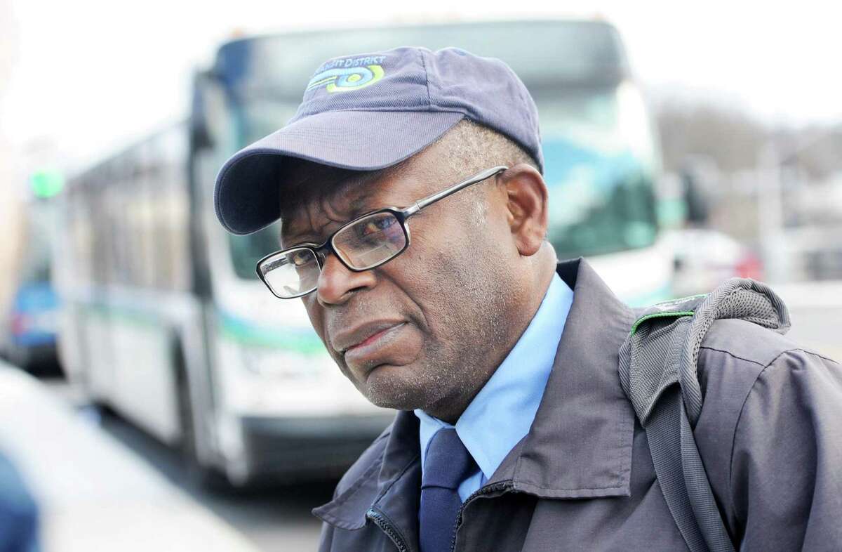 Driver Gerald Guerrier talks about the route cuts before heading out on a run at the Norwalk Transit - Wheels Hub on Burnell Boulavard in Norwalk, Conn. on Wednesday, Dec. 28, 2016. Riders and drivers will be affected by the Norwalk Transit District plan to introduce route cuts Jan. 29 as part of cost-saving measure that will also include a fare hike slated to begin Jan. 8.