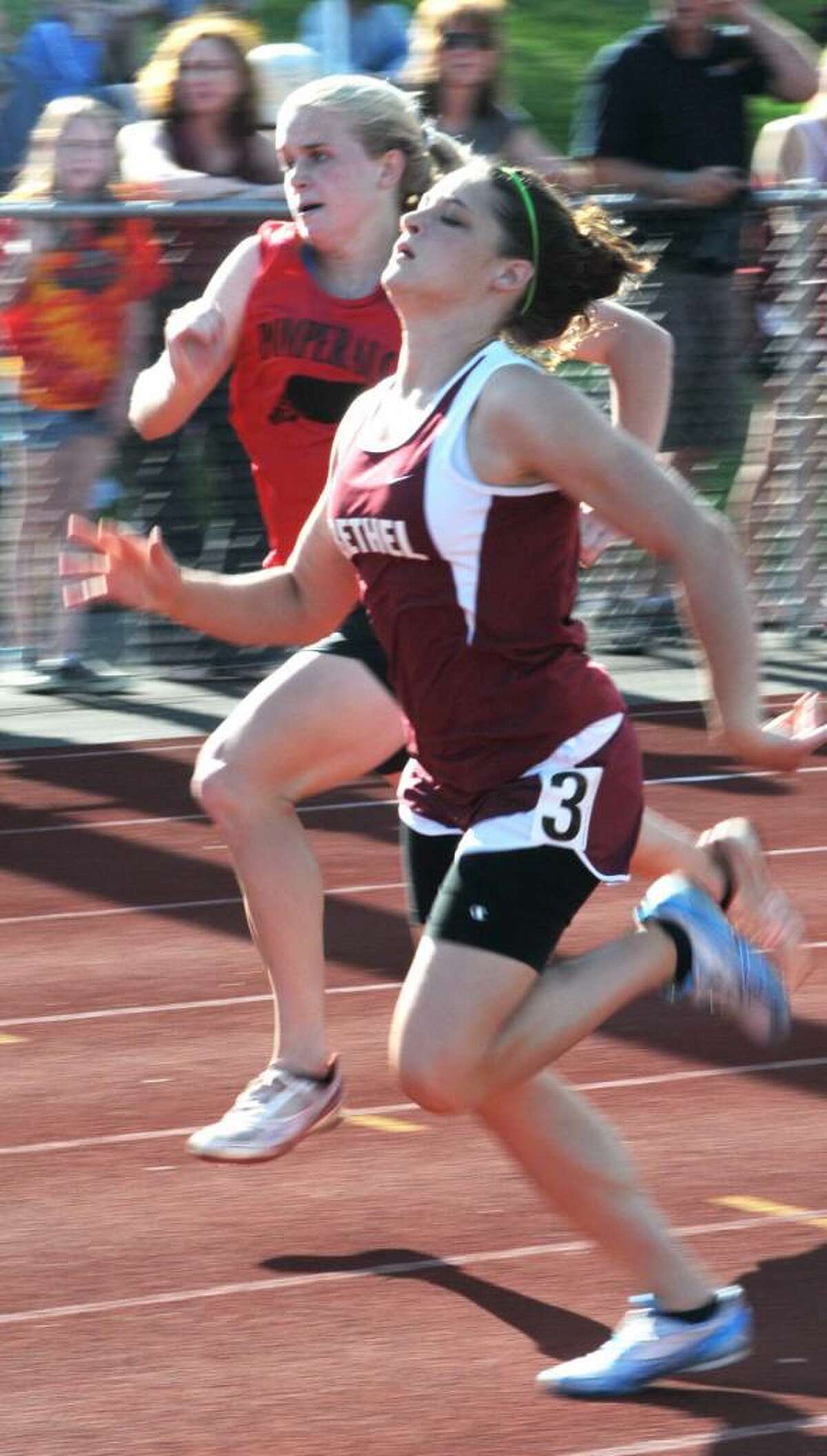 Lizzie Morton, of Bethel High School, runs the 100 meter dash, at the South West Conference girls Track and Field Championships, held at Pomperaug High School, on Monday, May 24, 2010.