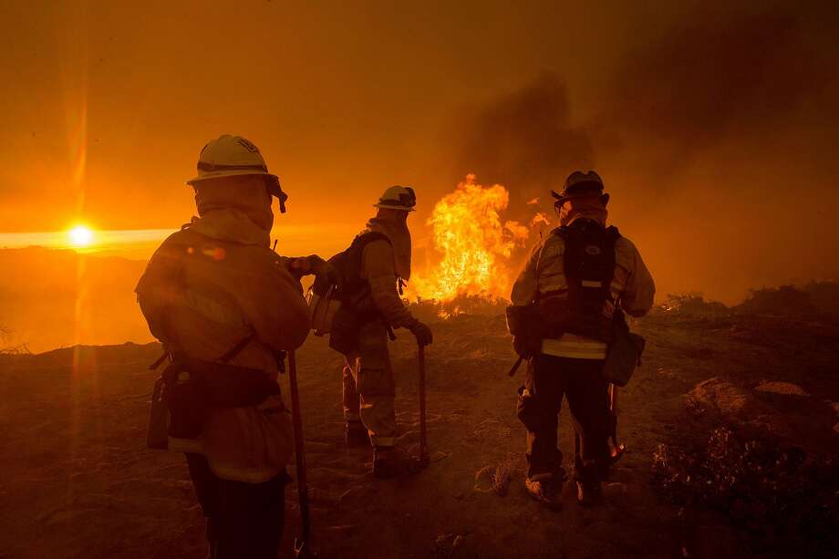 Firefighters battle the Soberane Fire as it jumps a containment line in Carmel Highlands, Calif., on Monday, July 25, 2016. Photo: Noah Berger / Special To The Chronicle 2016