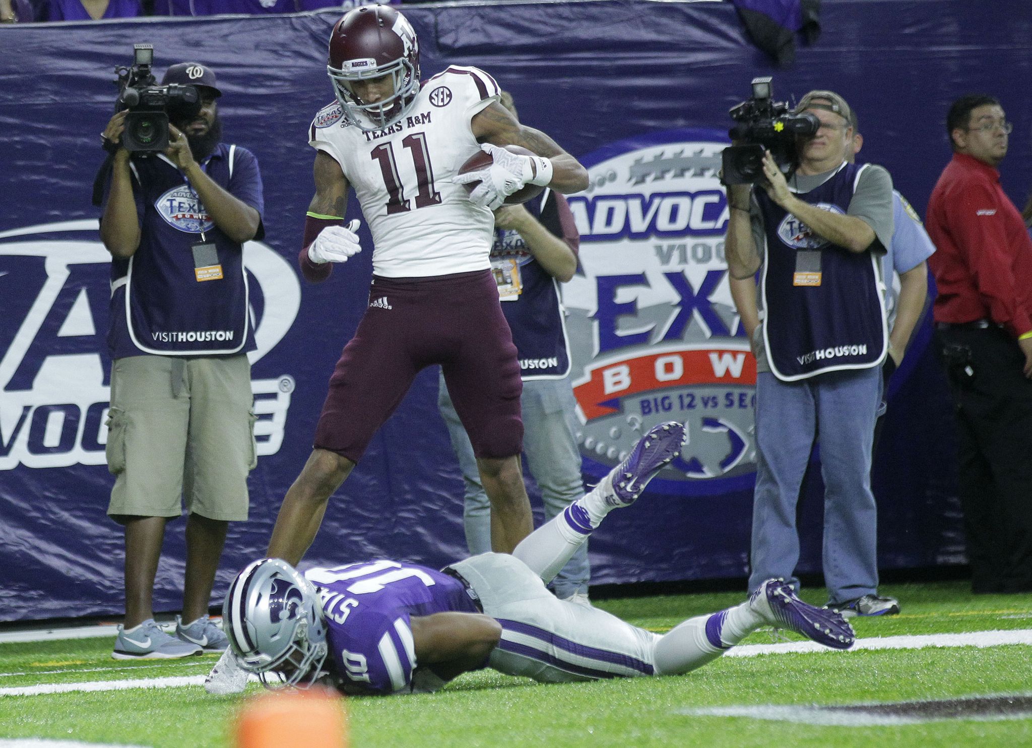 WATCH: Former Texas A&M stars Myles Garrett and Von Miller exchange jerseys