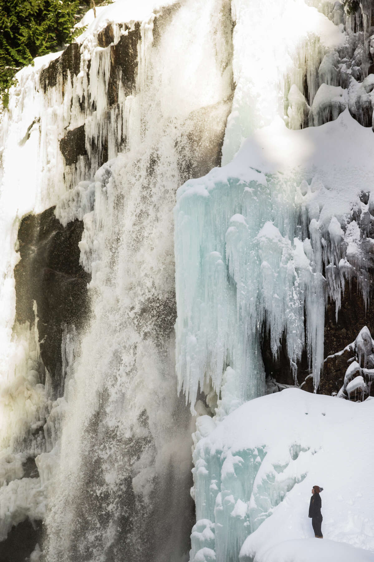 Franklin Falls flush with ice and hikers