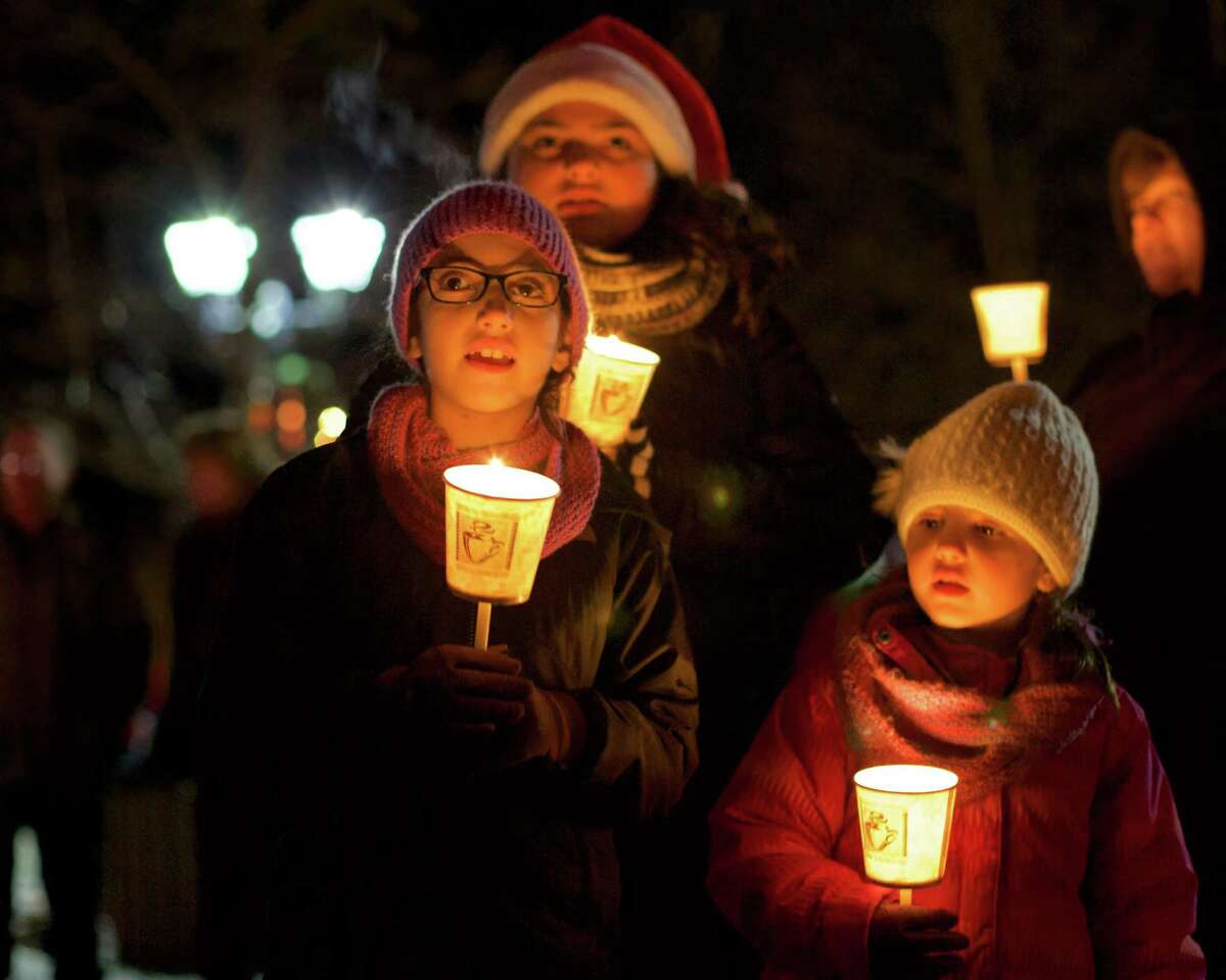 Singing "Joy to the World" during the annual Carol Sing in New Milford are, from left to right, Ava Morais, 8, of Danbury, Julisa Peralta, 11, of New Milford, and Alexa Morais, 5, of Danbury.