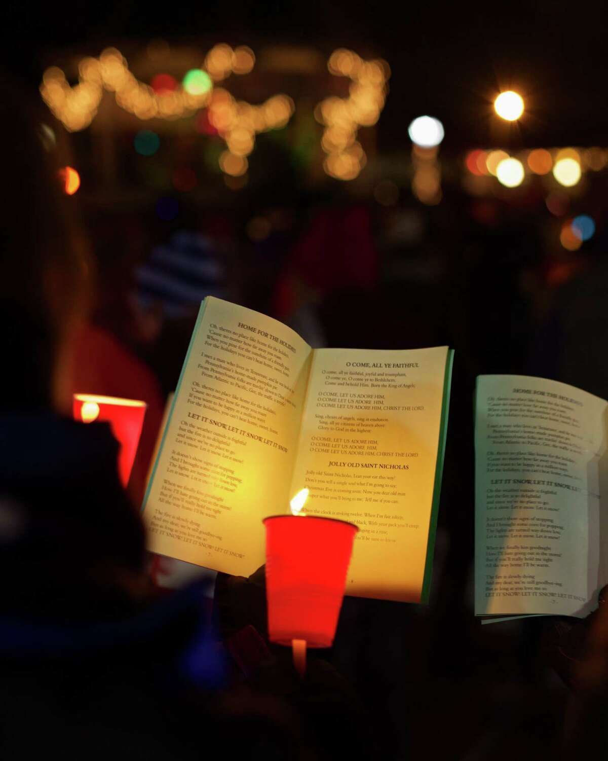 Carolers sang carols by candelight at the recent New Milford Commission on the Arts-sponsored event in New Milford.