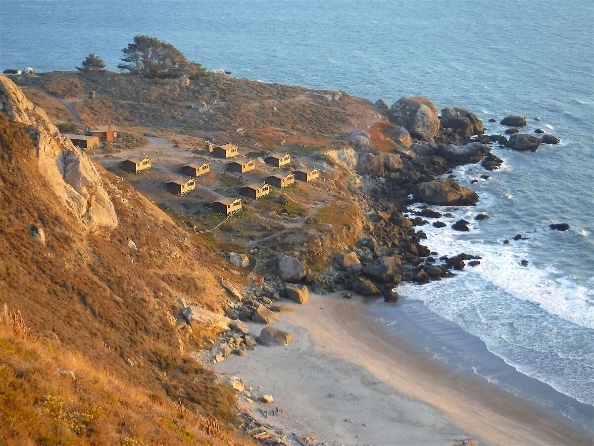 Dusk glow is cast across the rustic camping cabins at Rocky Point on the Marin coast, part of Mount Tamalpais State Park. Reservations for July go on sale at 8 a.m. Monday and are expected to sell out for the month in about 10 minutes.