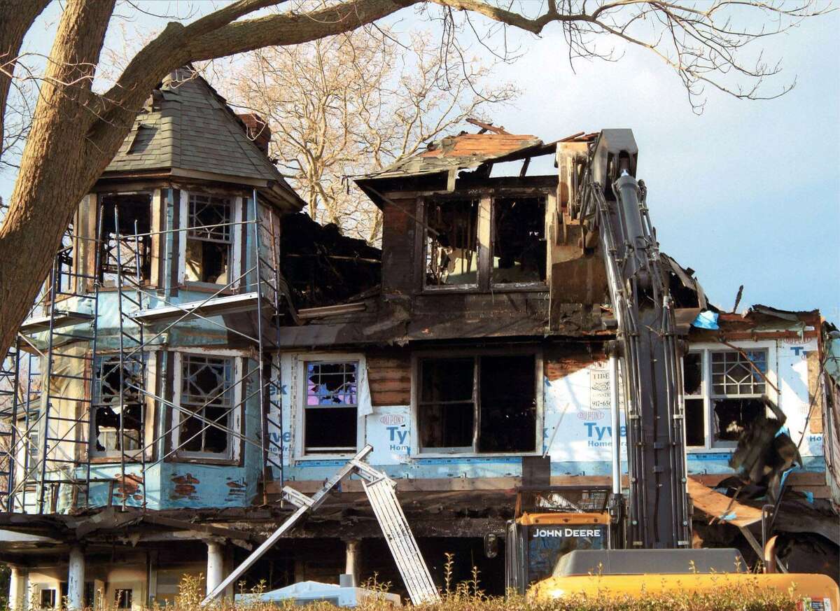 The exterior of Madonna Badger's Shippan home is seen after a fire on Christmas Day, 2011, tore through the home and killed her three daughters and their grandparents.