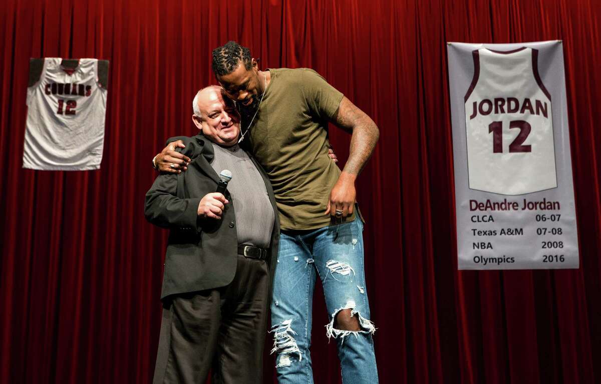 Jordan embraces Pastor Richard Rodriguez, who was cited in one of Jordan's high school memories.