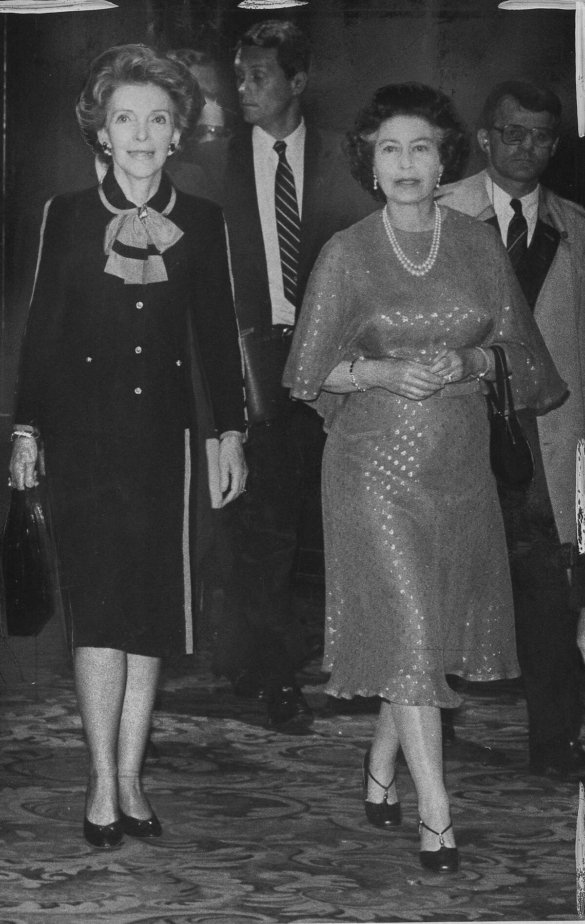 Queen Elizabeth II of Great Britain visits San Francisco. She is seen here with First lady Nancy Reagan in the St Francis Hotel lobby, on their way to dinner, March 2, 1983 Photo ran 03/03/1983, p. 21