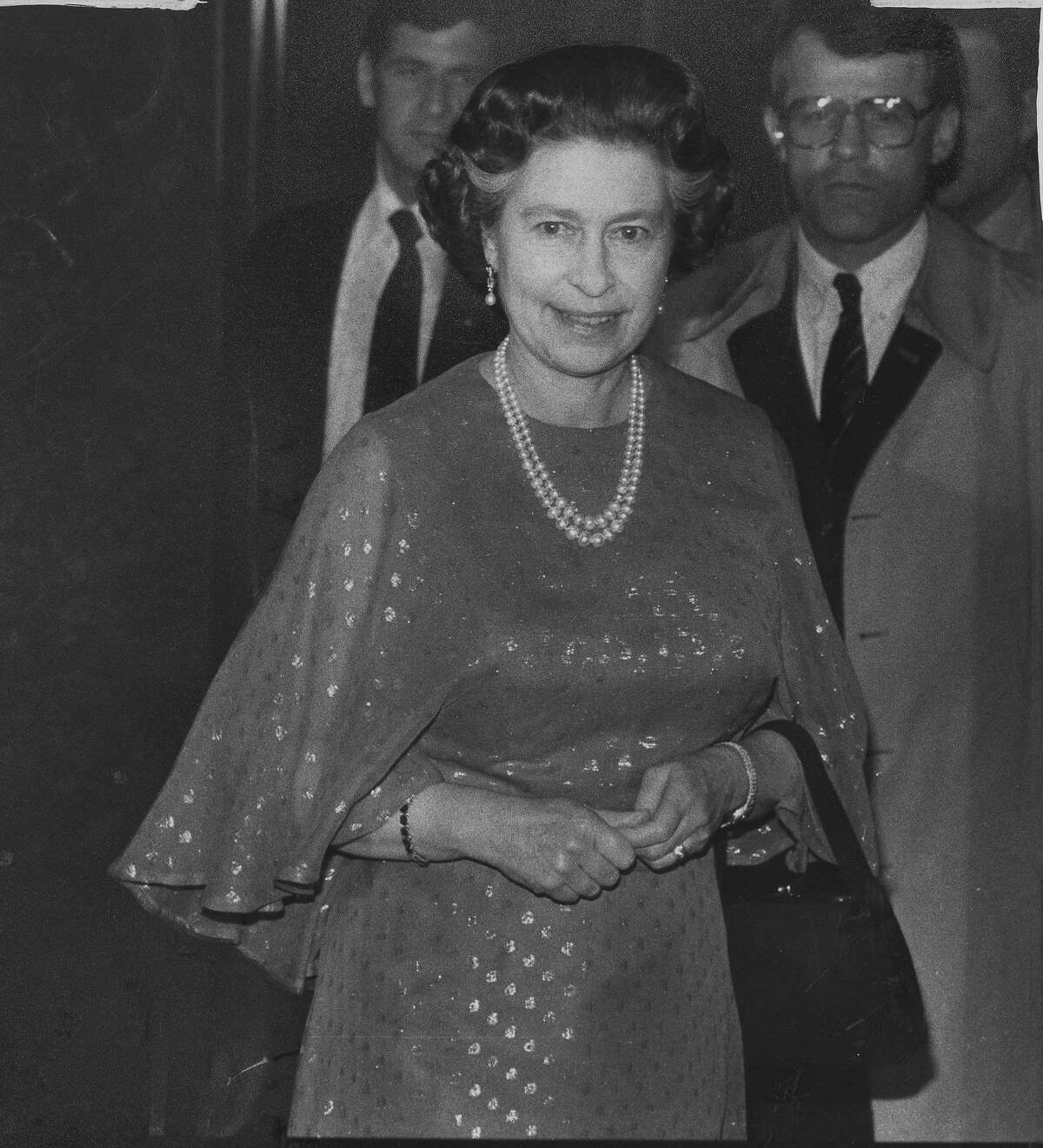 Queen Elizabeth II of Great Britain visits San Francisco. She is seen here in the St Francis Hotel lobby, on their way to dinner, March 2, 1983 Photo ran 03/03/1983, p. 13