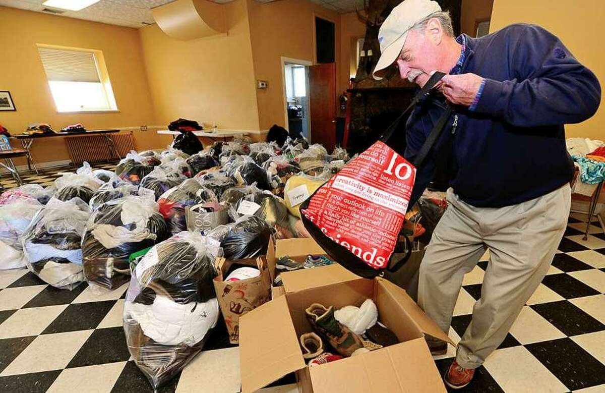 David Lindsay sorts outerwear during the Rowayton Community Association's inaugural winter “Bundle Up Rowayton” clothing drive at the Rowayton Community Center to benefit the Open Door Shelter in South Norwalk.