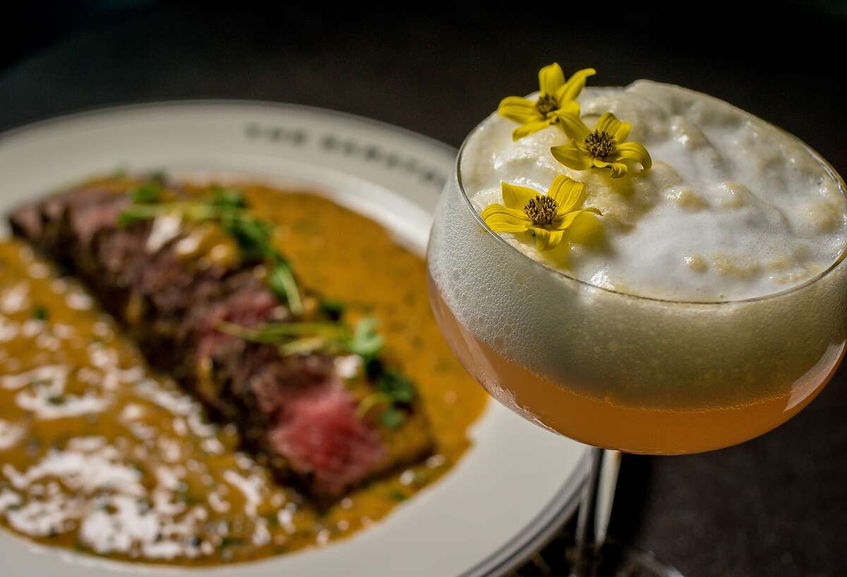 The "Grand Pedennis" cocktail with the Flannery's Dry-Aged New York Steak at the Saratoga in San Francisco, Calif. is seen on December 31st, 2016.