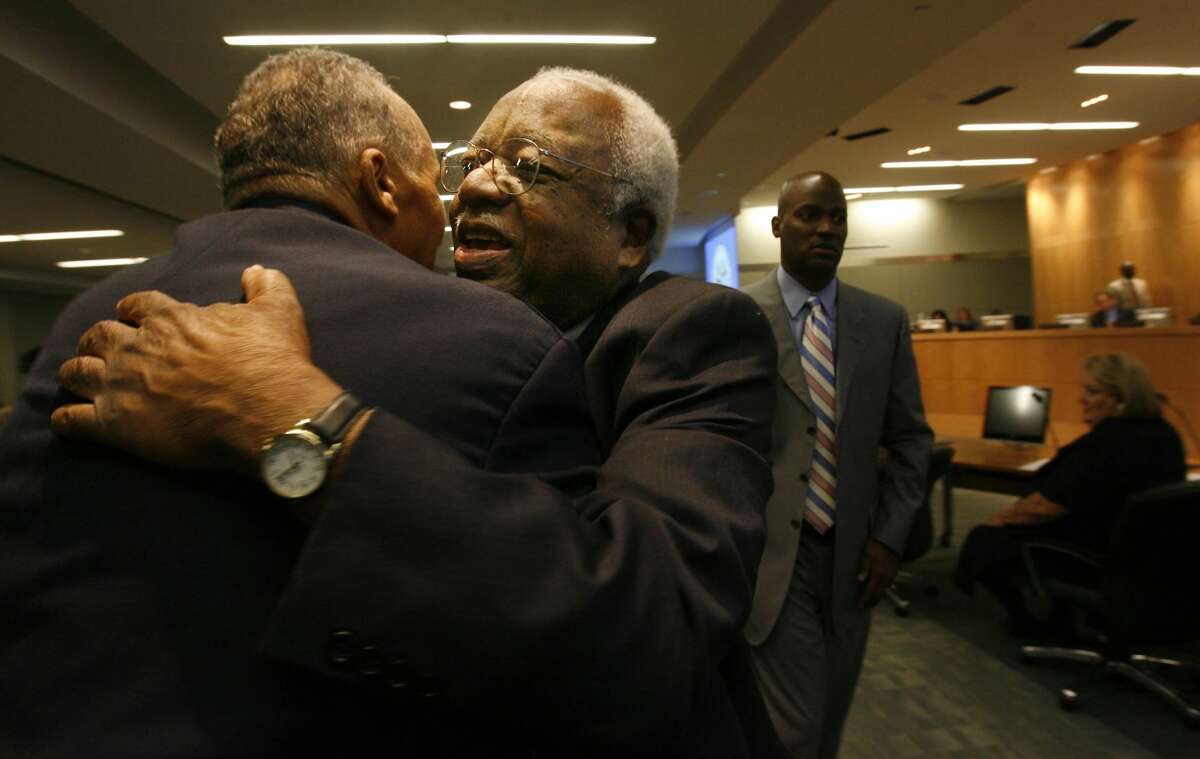 (Left to right) John Codwell Jr. embraces Arthur Gaines, 81, a Houston Independent School District Board Trustee of 16 years who is now retiring from public service on Thursday, August 9, 2007 in Houston, TX. John Codwell Jr., attended board meeting because HSID board members named a building after his father Dr. John E. Codwell Sr., and Gaines was congratulating him. Photo by Mayra Beltran / Chronicle