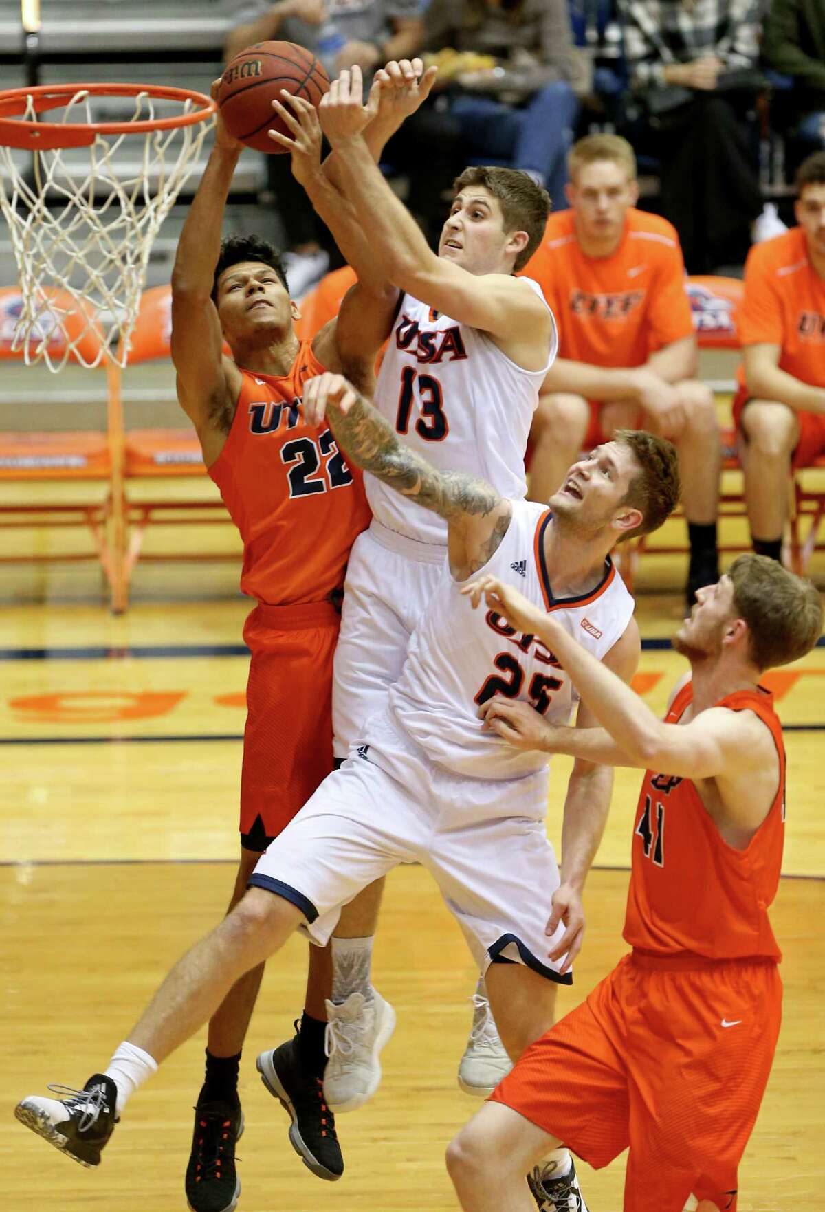 UTEP’s Paul Thomas (from left) and UTSA’s Byron Frohnen and Nick Allen battle for rebound during first half action on Jan. 1, 2017 at the Convocation Center.