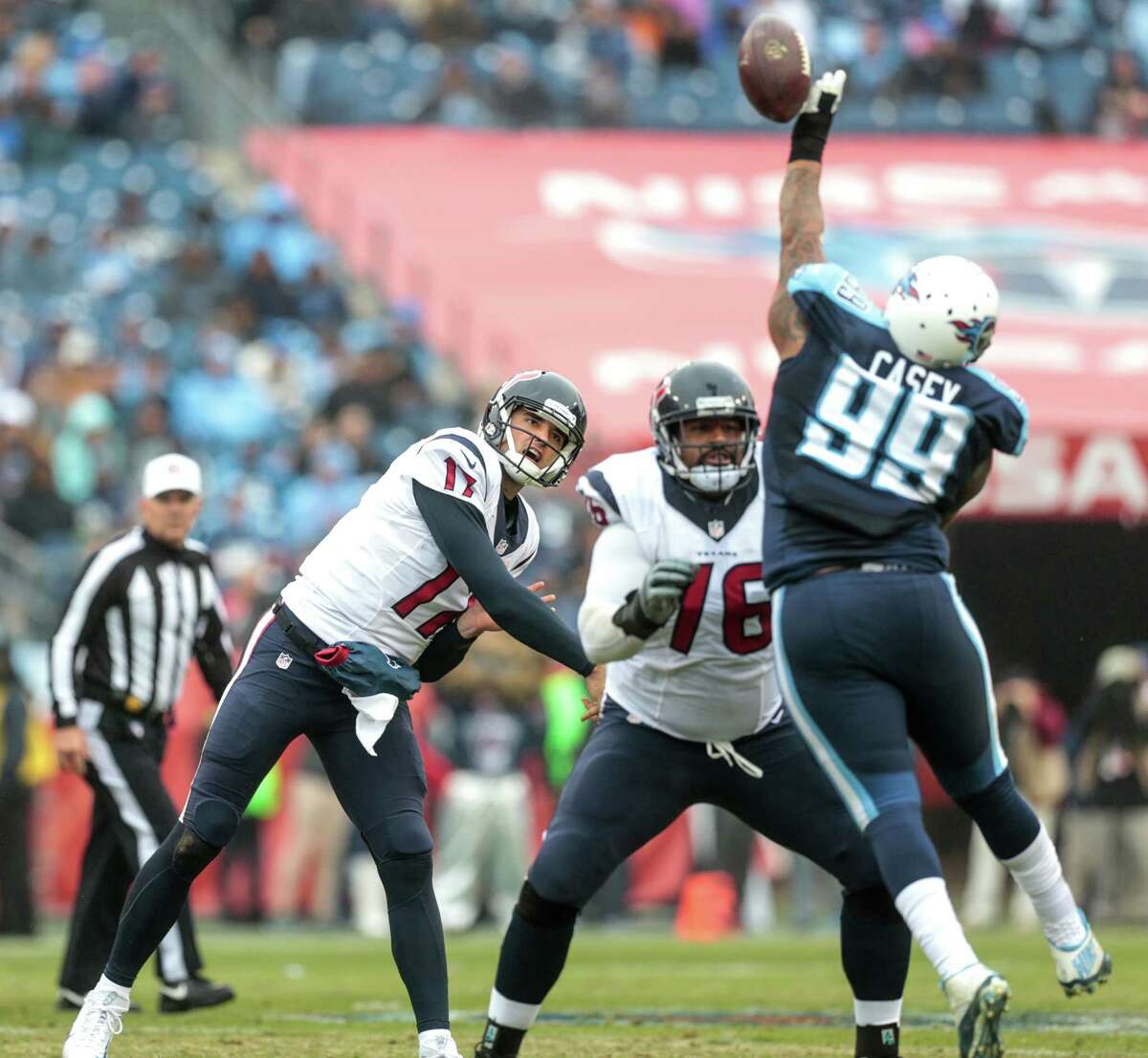 Titans tackle Jurrell Casey (99) deflects a pass by quarterback Brock Osweiler during the second quarter of the Texans' loss.