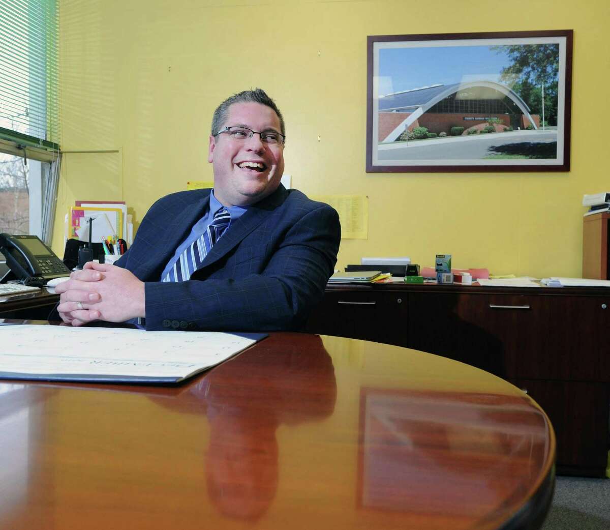 The new Trinity Catholic High School Principal, David Williams, in his office at the school in Stamford, Conn., Wednesday, Dec. 21, 2016.
