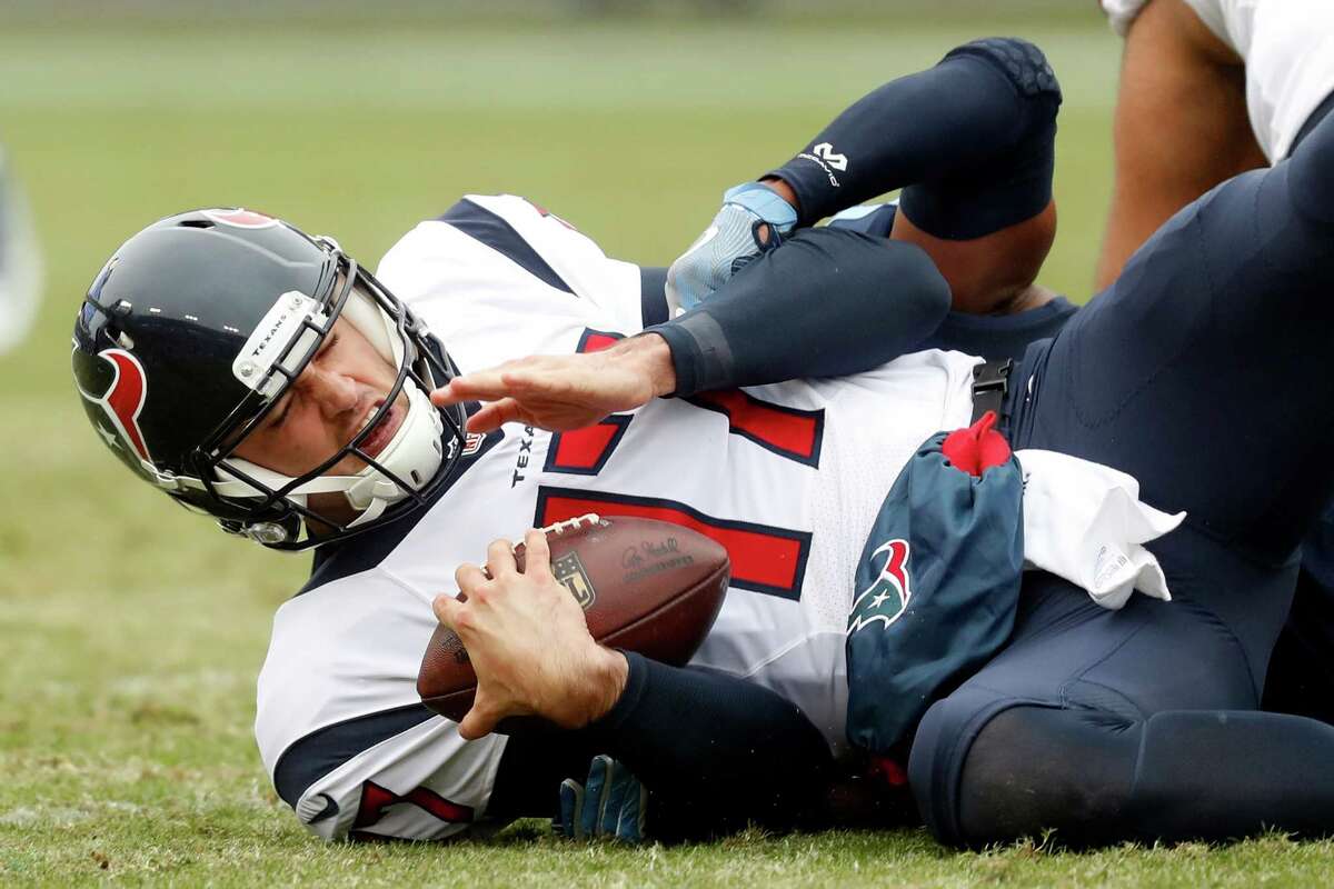 Houston Texans quarterback Brock Osweiler is tackled in the first half of an NFL football game against the Tennessee Titans Sunday, Jan. 1, 2017, in Nashville, Tenn. (AP Photo/Weston Kenney)