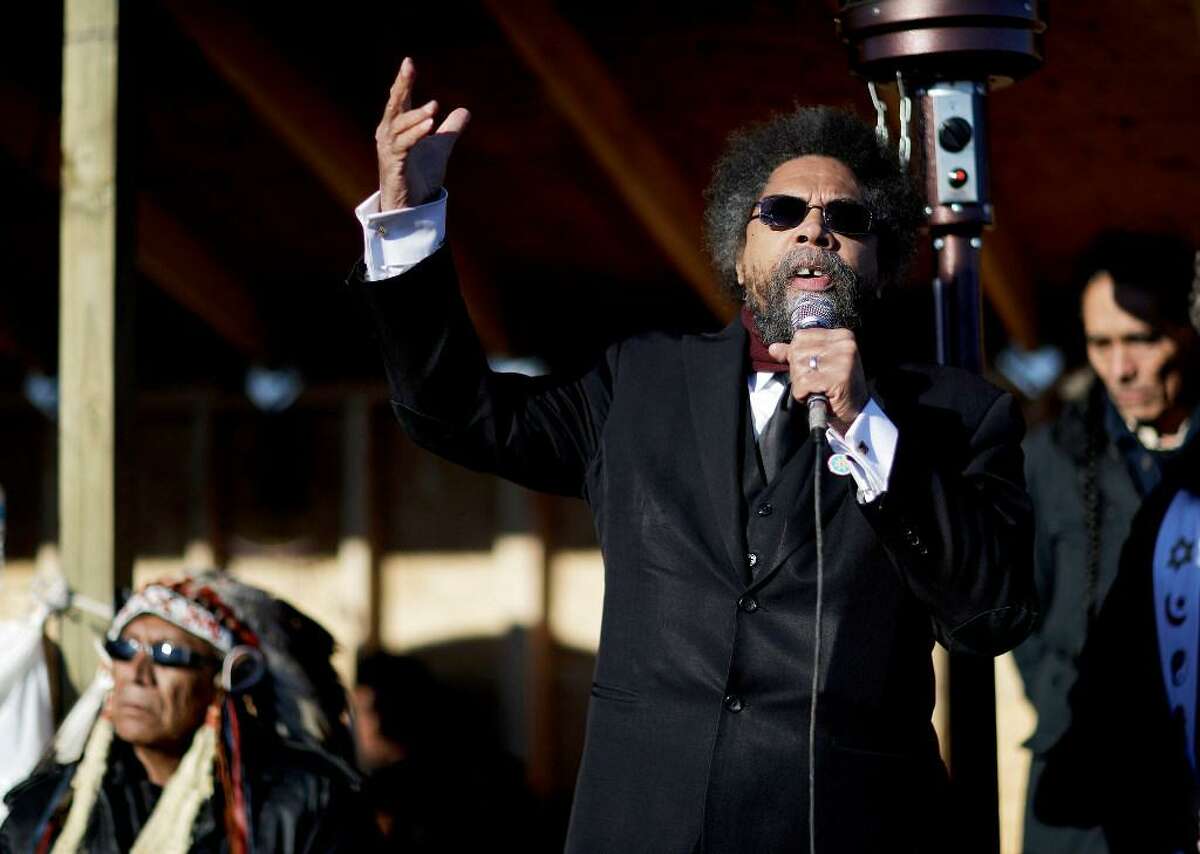 Cornel West, right, speaks next to Chief Arvol Looking Horse, a spiritual leader of the Great Sioux Nation, during an interfaith ceremony at the Oceti Sakowin camp where people have gathered to protest the Dakota Access oil pipeline in Cannon Ball, N.D., Sunday, Dec. 4, 2016.