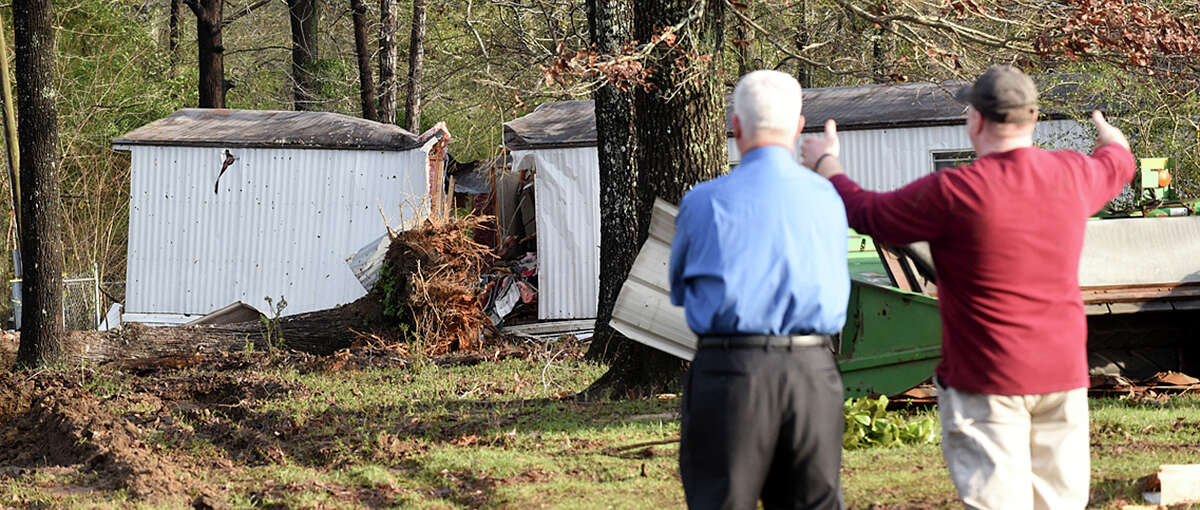 Patrick Davenport, left, and neighbor J.P. Kelley view the scene of Monday's ﻿tornado that claimed the lives of multiple people near Rehobeth, Ala. and eased drought conditions﻿ across the Southeast.